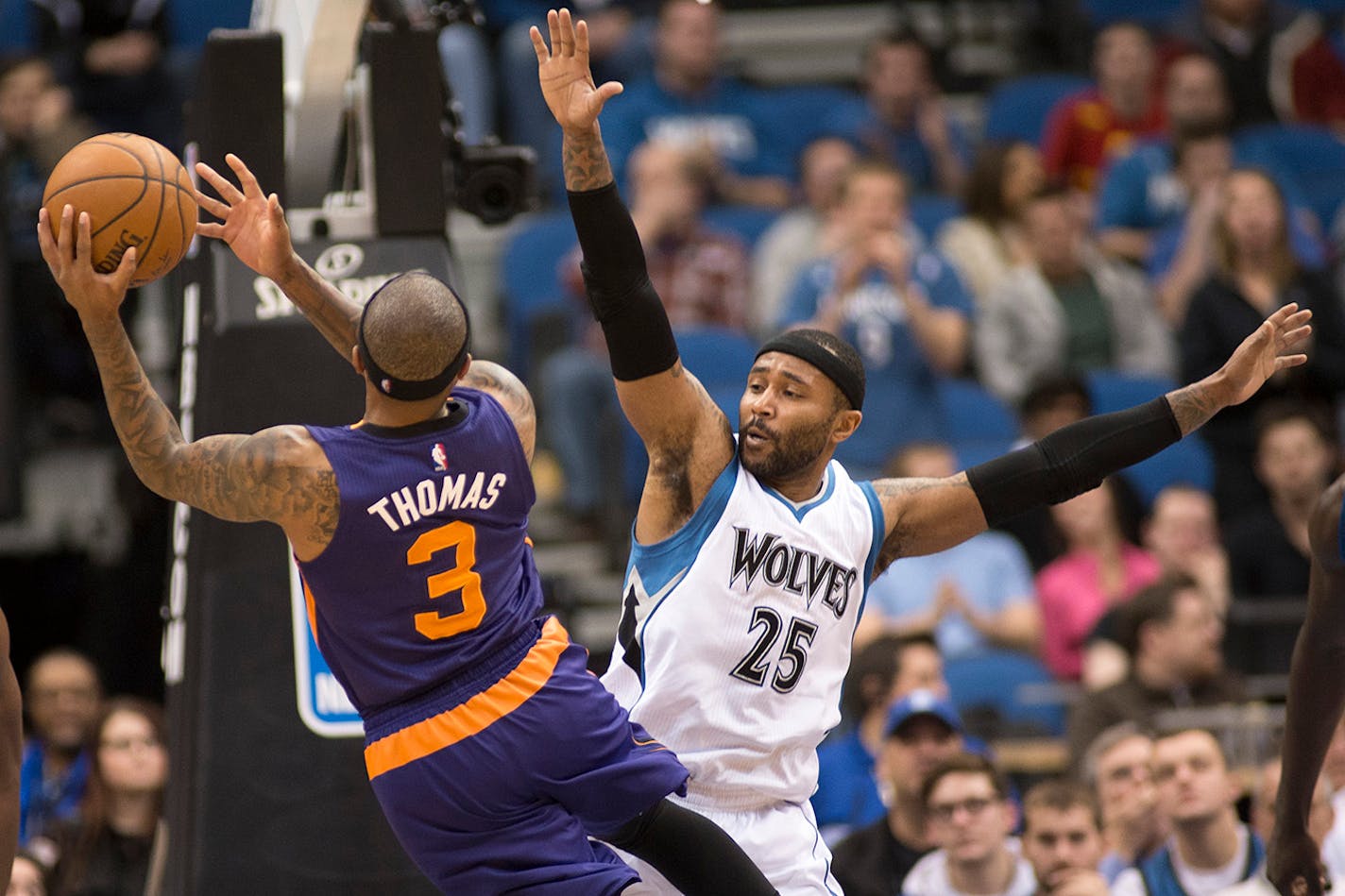 Phoenix Suns guard Isaiah Thomas (3) hits a shot while being defended by Minnesota Timberwolves guard Mo Williams (25) during the fourth quarter.