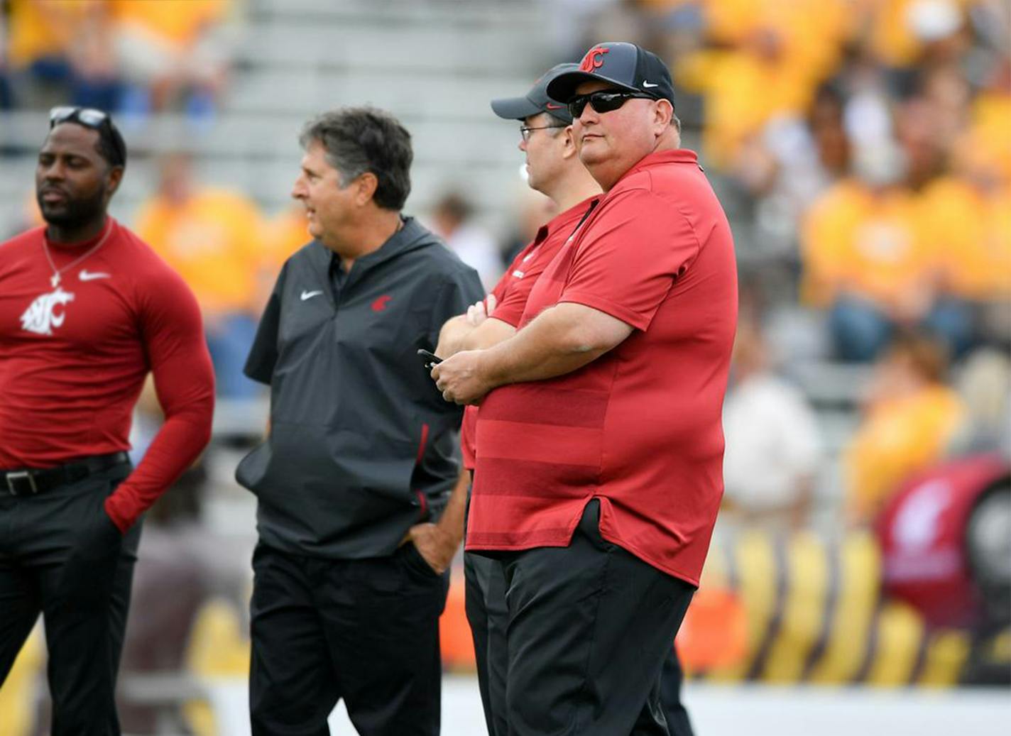 Credit: Tyler Tjomsland/The Spokesman-Review. Tracy Claeys, defensive coordinator, was on the field with his fellow coaches before a Washington State game in August, 2018.