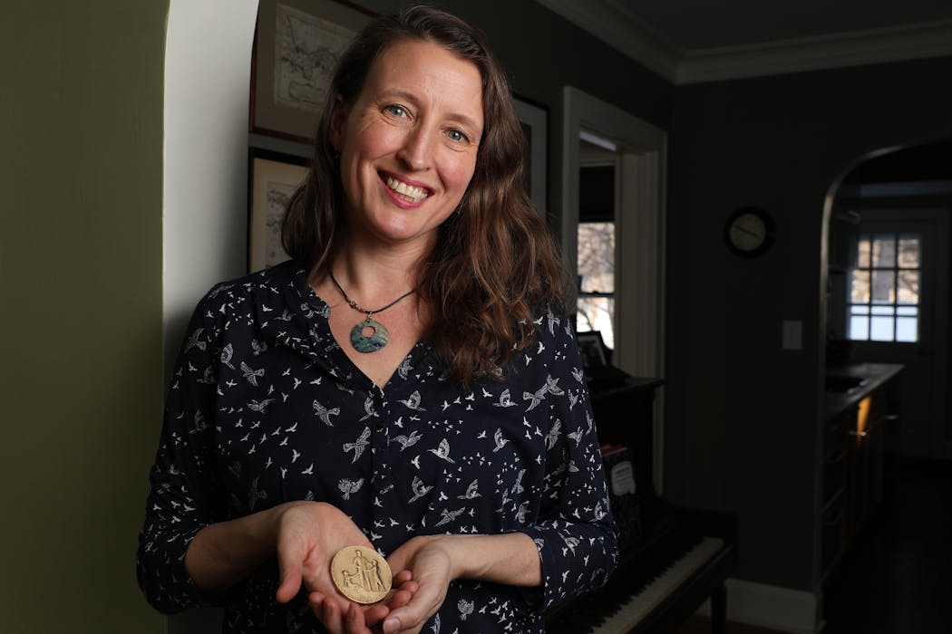 Author Kelly Barnhill stood for a portrait with her Newbery Award at her home in Minneapolis in February 2018.
