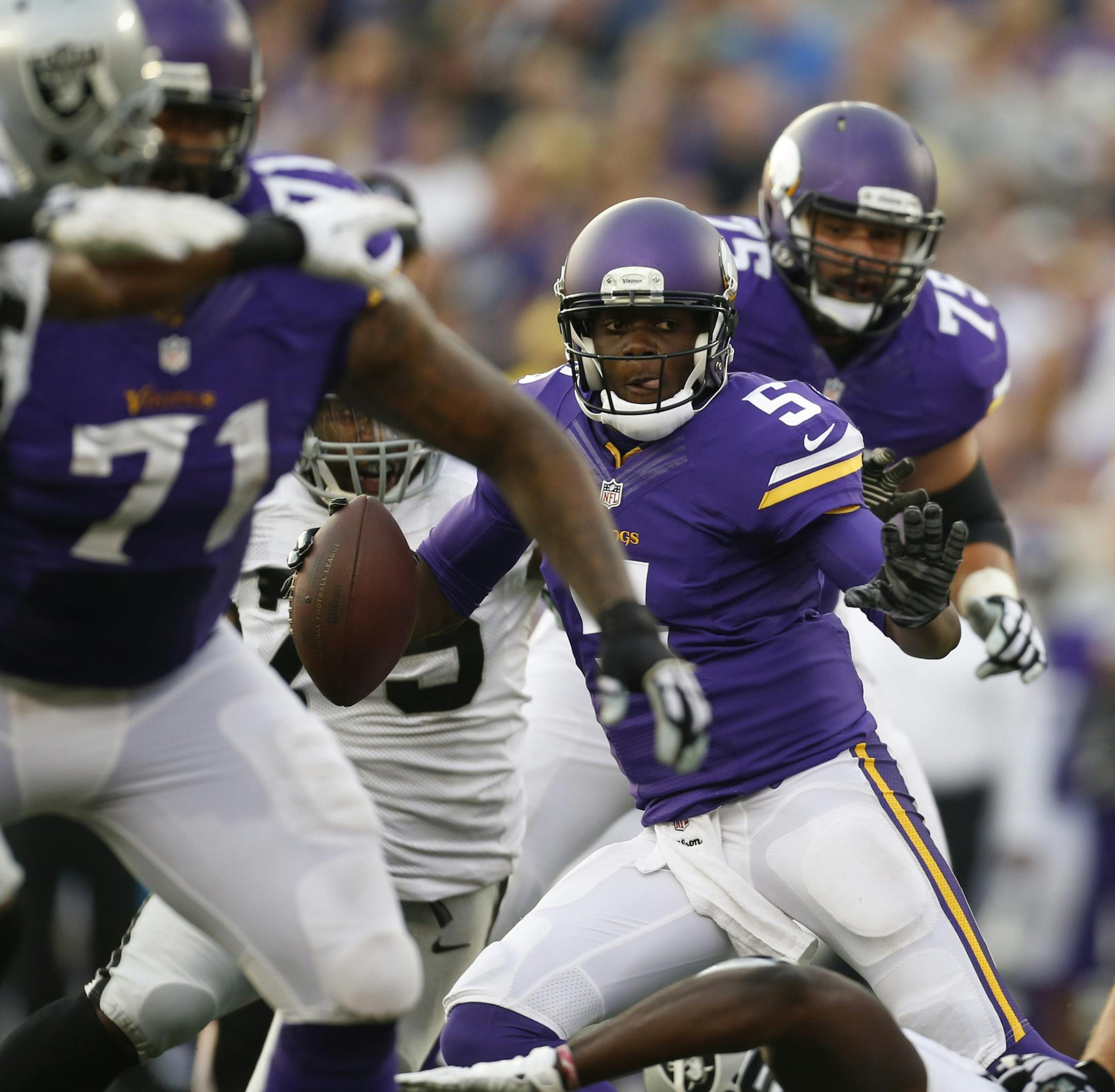 Minnesota Vikings quarterback Teddy Bridgewater (5) about to be sacked and stripped of the ball by Oakland Raiders defensive end Shelby Harris (75) for a nine yard loss in the first quarter Thursday evening. ] JEFF WHEELER ‚Ä¢ jeff.wheeler@startribune.com The Minnesota Vikings opened their preseason with a game against the Oakland Raiders Thursday night, August 8, 2014 at their temporary home at TCF Bank Stadium in Minneapolis.