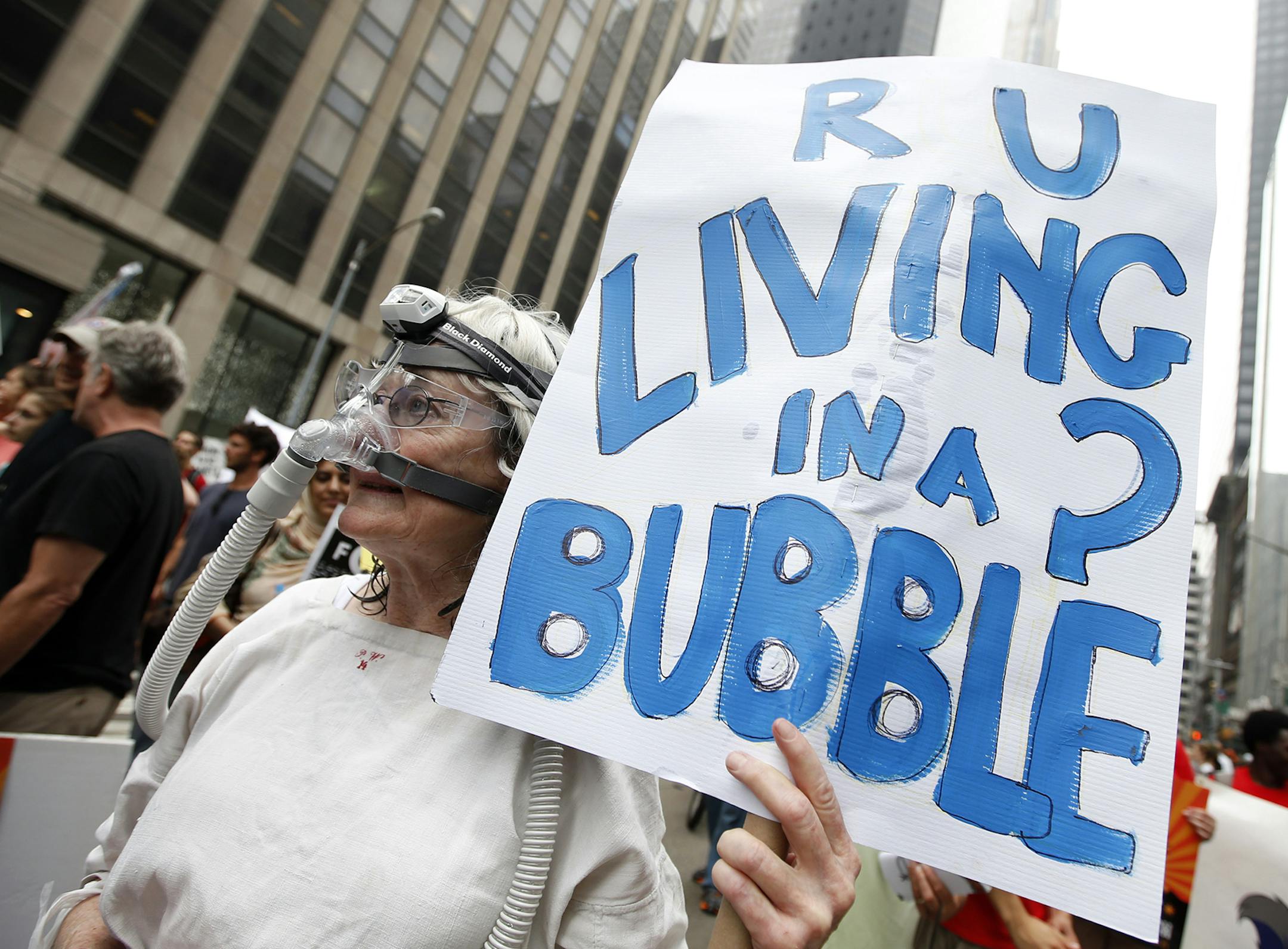 Demonstrators make their way down Sixth Avenue in New York during the People's Climate March Sunday, Sept. 21, 2014. The march, along with similar gatherings scheduled in other cities worldwide, comes two days before the United Nations Climate Summit, where more than 120 world leaders will convene for a meeting aimed at galvanizing political will for a new global climate treaty by the end of 2015. (AP Photo/Jason DeCrow) ORG XMIT: NYJD118