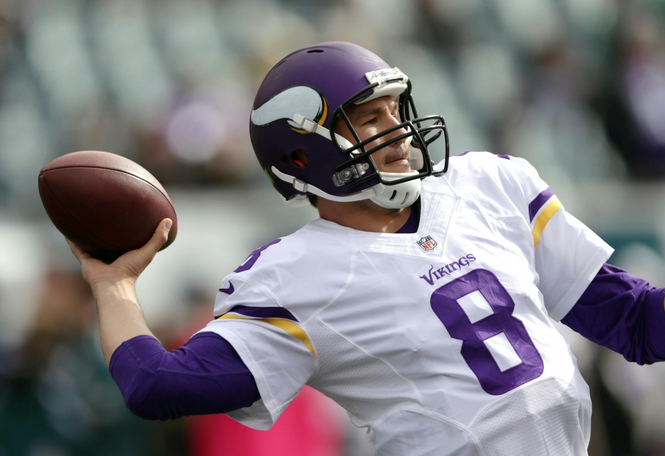 Vikings QB Sam Bradford warms up his arm before the start of the game against his former team the Eagles.