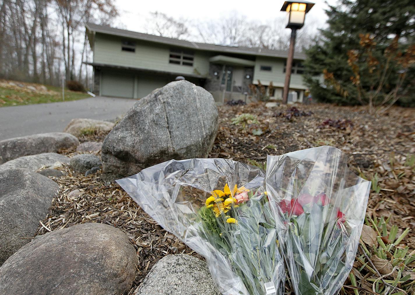 Flowers were left at the home of Dr. Stephen Larson, 74, a surgeon who was slain Friday night. Police later shot and killed an armed Ted Hoffstrom, 30, outside of Larson&#x2019;s home.