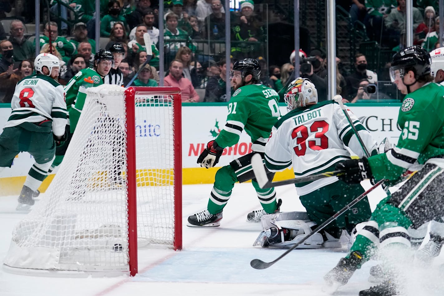 Minnesota Wild goaltender Cam Talbot (33) looks back to see the puck in the net after Dallas Stars' Tyler Seguin (91) scored in the first period of an NHL hockey game in Dallas, Monday, Dec. 20, 2021. (AP Photo/Tony Gutierrez)