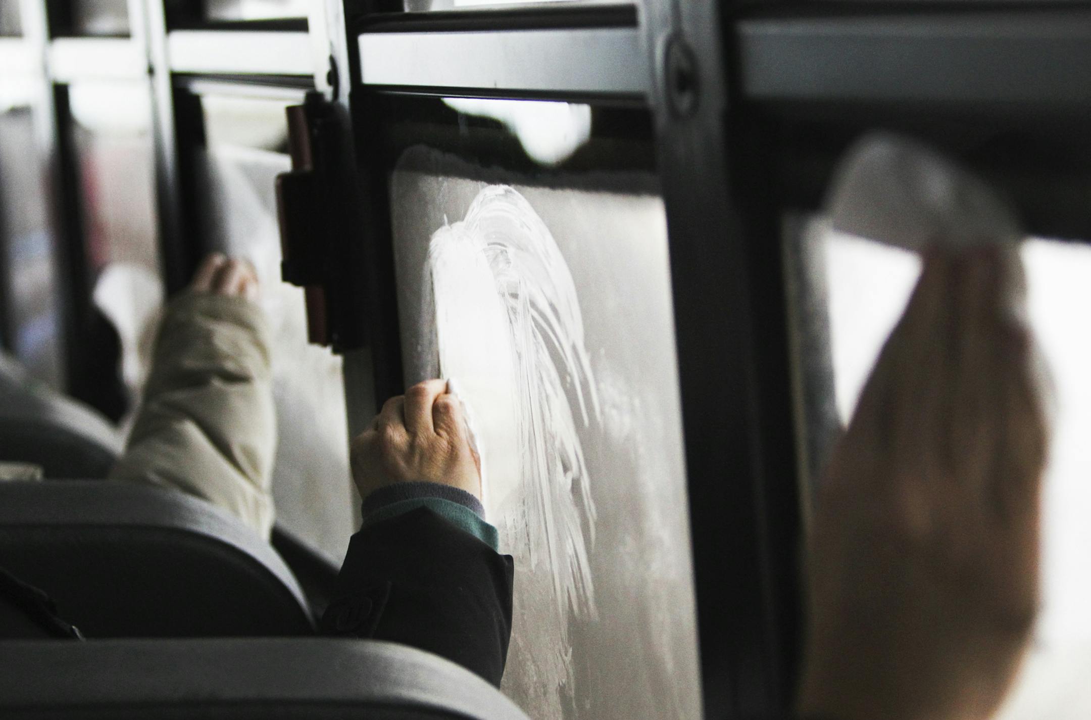 During a dusk search trip for Great Gray Owls as part of the Sax-Zim Winter Birding Festival, birders try to clear frost from the school bus windows Friday, Feb. 15, 2013, in Meadowlands, MN.] (DAVID JOLES/STARTRIBUNE) djoles@startribune.com Every mid-February, bird watchers from around the country -- and even a few from overseas -- gather before dawn in a frozen bog in northern Minnesota for the Sax-Zim Winter Birding Festival. Bundled in every piece of warm clothing they own and facing frigid