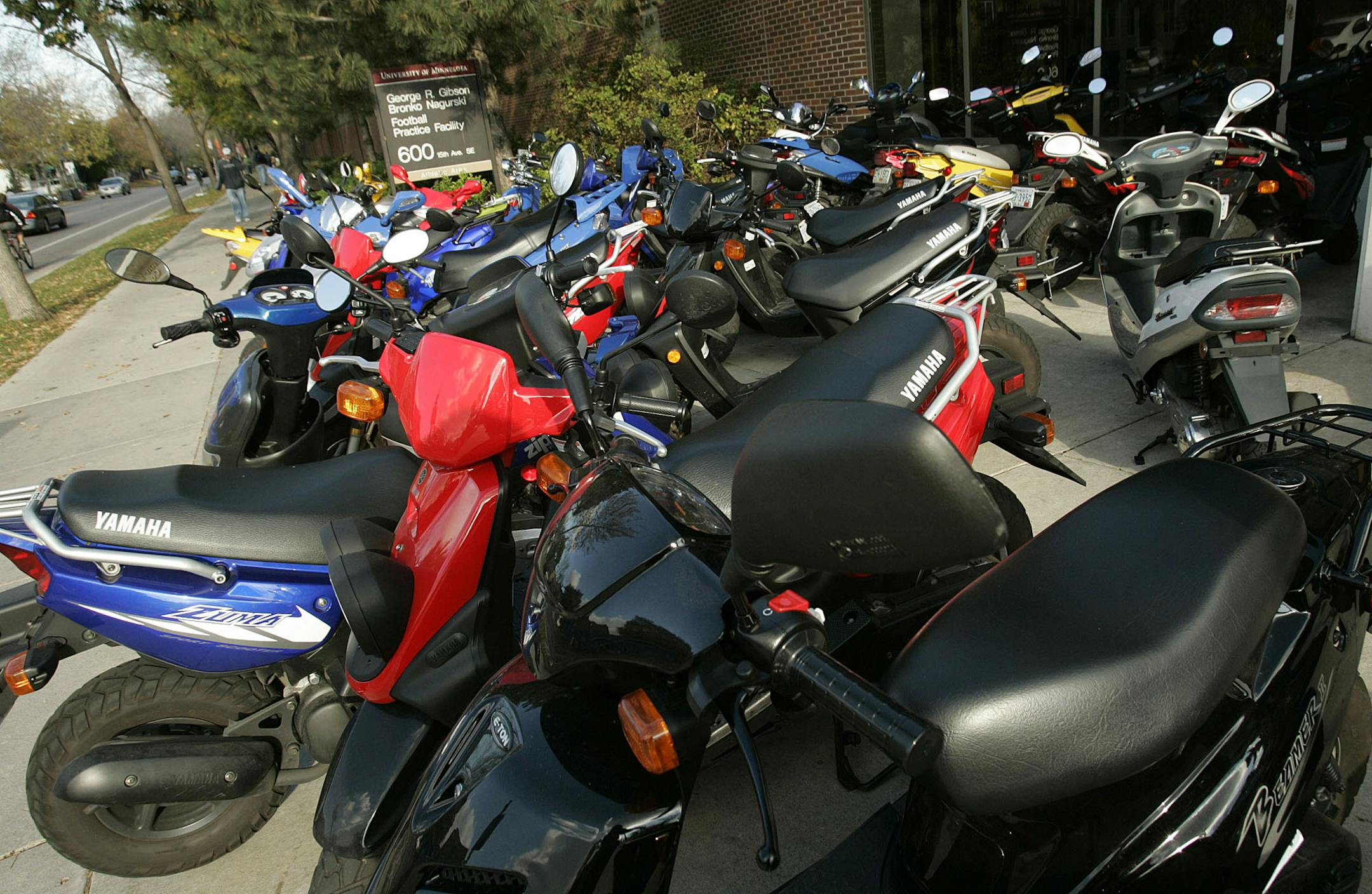 DAVID JOLES � djoles@startribune.com A small sea of mopeds and small scooters has a home outside the George R. Gibson Bronko Nagurski football practice facility Wednesday, Oct. 28, 2005, on the University of Minnesota campus. Some Gopher football players find the small, relatively speedy and easy to manuever mopeds a good way to get around campus.