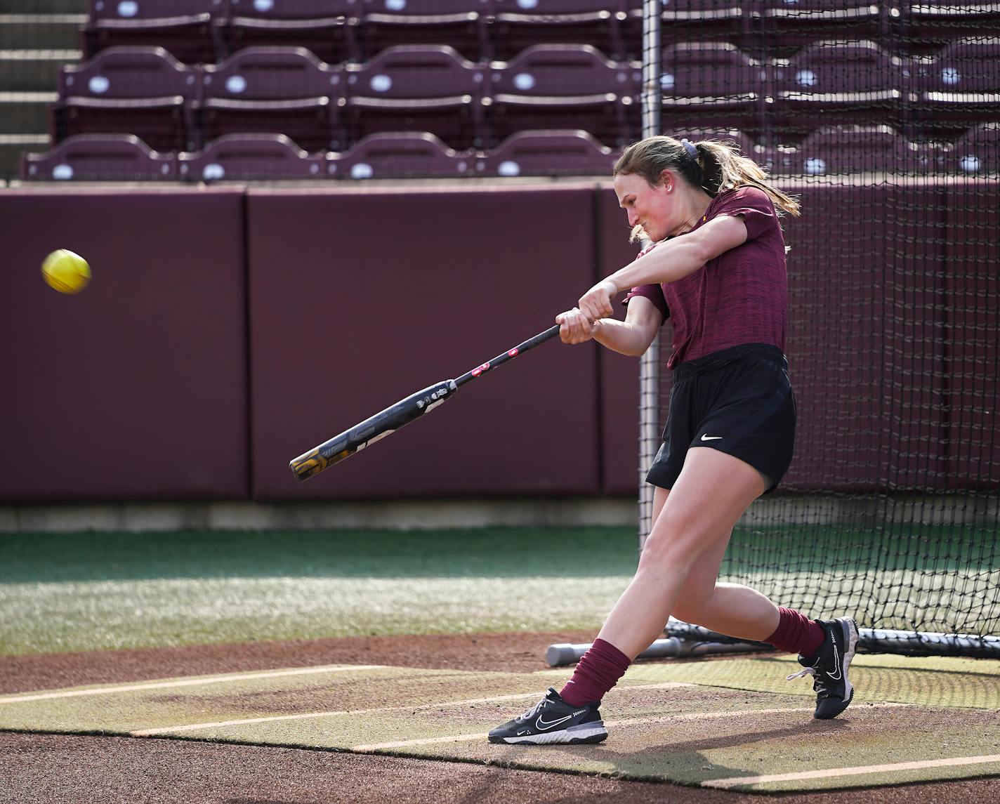 University of Minnesota women's softball left fiedler Natalie DenHartog from Hopkins, who has 18 homers going into the Big 10 tourney, rips a ball during batting practice at Jane Sage Cowles Stadium Tuesday, May 10, 2022 in Minneapolis, Minn. ]