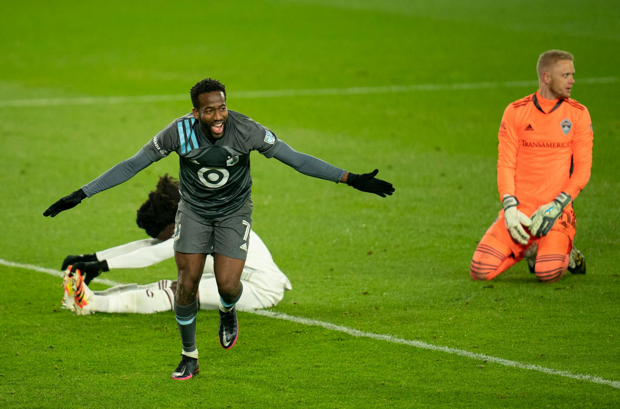 Minnesota United midfielder Kevin Molino (7) celebrates his second goal after beating Colorado Rapids goalkeeper William Yarbrough, right, during an MLS first-round playoff soccer match Sunday, Nov. 22, 2020, in St. Paul, Minn. (Jeff Wheeler/Star Tribune via AP)