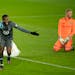 Minnesota United midfielder Kevin Molino (7) celebrates his second goal after beating Colorado Rapids goalkeeper William Yarbrough, right, during an M