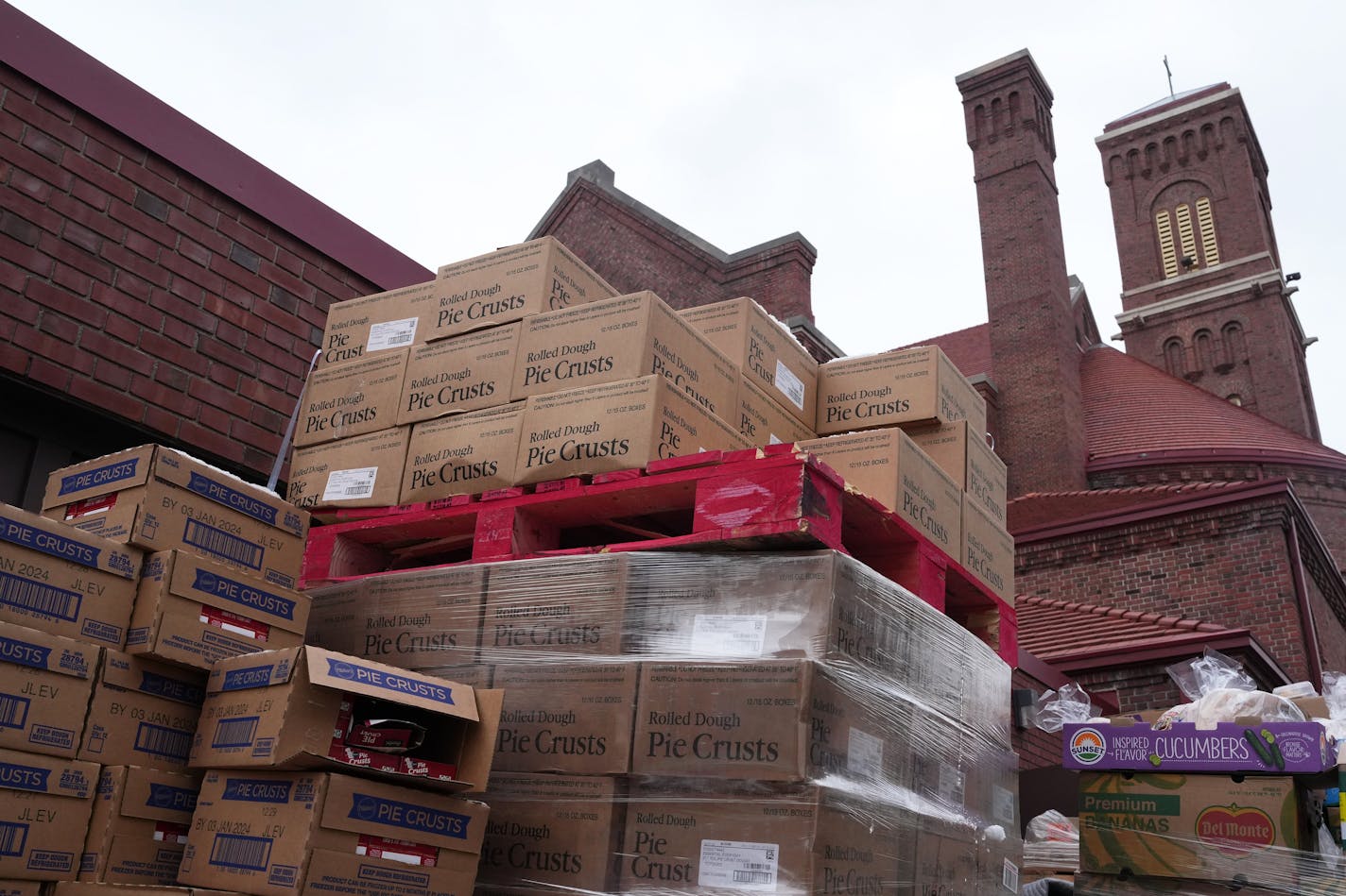 Pallets of pie crusts sit in the alley behind Harvest of the Heart food pantry Wednesday, Jan. 3, 2024 at the Incarnation Catholic Church in south Minneapolis. The food pantry was donated several pallets of pie crusts that were too numerous to fit in their freezer or distribute. ] ANTHONY SOUFFLE • anthony.souffle@startribune.com