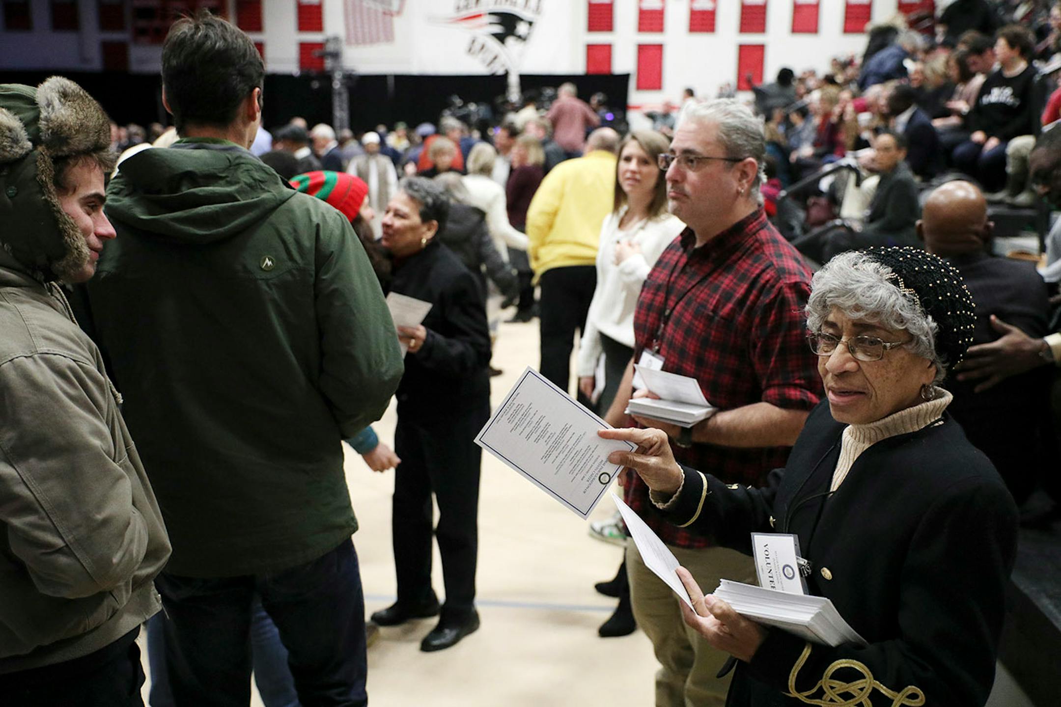 Jackye Whitner of Mounds View passed out programs prior to Melvin Carter's swearing in ceremony as St. Paul mayor.