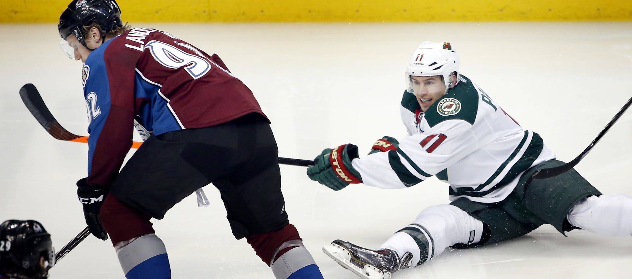 Gabriel Landeskog (92) and Zach Parise (11) fought for the puck in the second period. ] CARLOS GONZALEZ cgonzalez@startribune.com - April 19, 2014, Denver, Colorado, Pepsi Center, NHL, Minnesota Wild vs. Colorado Avalanche, Stanley Cup Playoffs round 1, Game 2