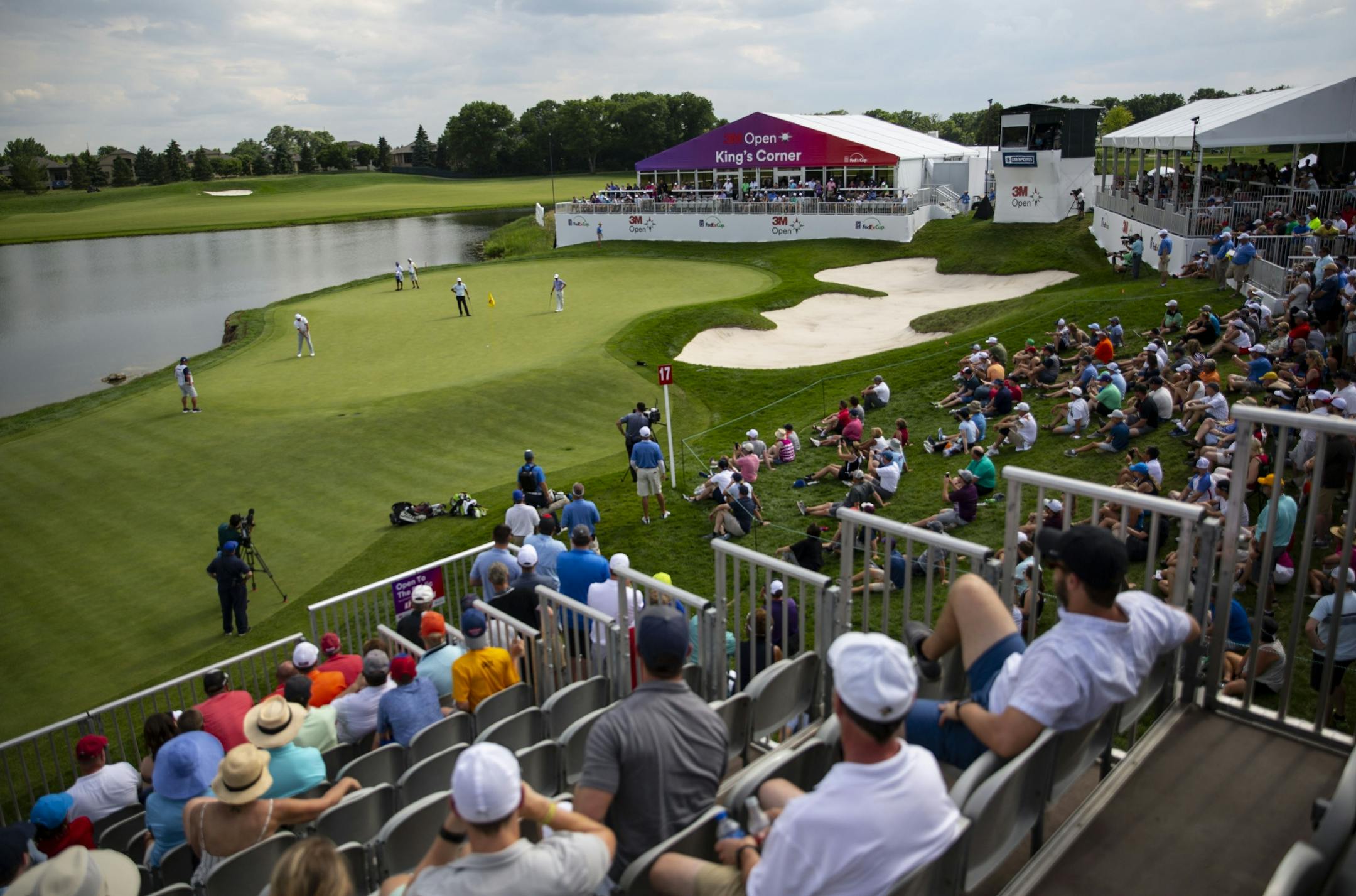 Bryson DeChambeau putts on the seventeenth hole surrounded by a large crowd. ALEX KORMANN ¥ alex.kormann@startribune.com Competitors for the 3M Open took to the course on Saturday.