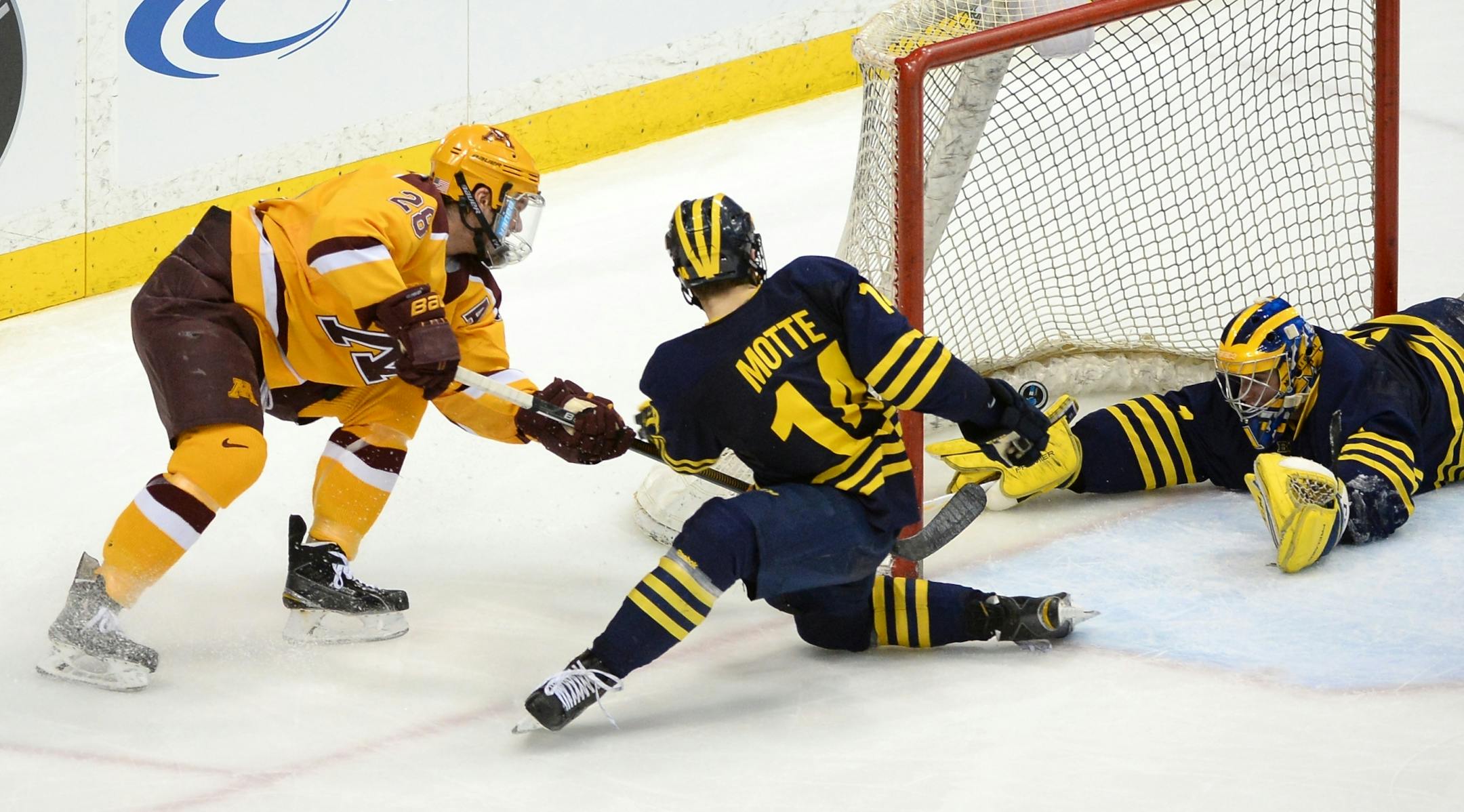 Minnesota Golden Gophers defenseman Jake Bischoff (28) scored a goal off a wraparound shot on Michigan Wolverines goalie Steve Racine (1) in the second period Saturday.