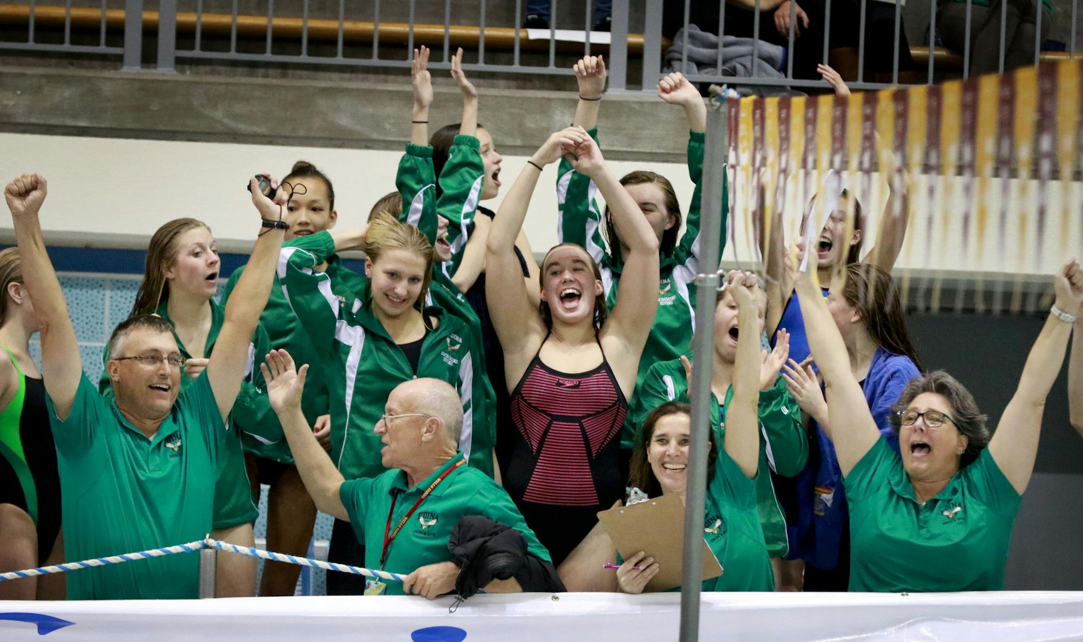 Edina swimmers and coaches celebrate their team's 400 yard freestyle win, the meet's final event, giving Edina the team title as well during the Class 2A high school girls' swimming and diving state meet finals Friday, Nov. 18, at the University of Minnesota Aquatic Center in Minneapolis, MN.] (DAVID JOLES/STARTRIBUNE)djoles@startribune.com Class 2A high school girls' swimming state meet finals