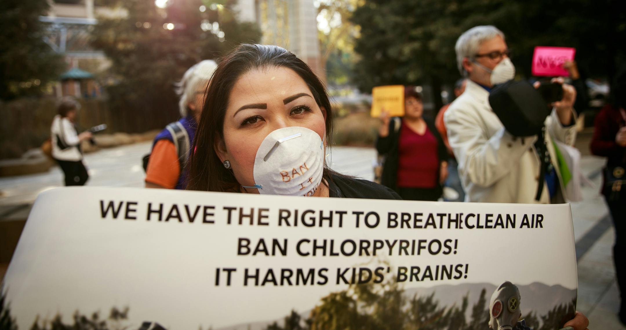 FILE -- Protesters outside the California Environmental Protection Agency headquarters after a public hearing on increasing restrictions on the use of the agricultural pesticide chlorpyrifos, in Sacramento, Calif., on Nov. 8, 2018. The EPA on Thursday, July 18, 2019, announced it would not ban the widely-used pesticide associated with developmental disabilities and other health problems in children. (Max Whittaker/The New York Times)