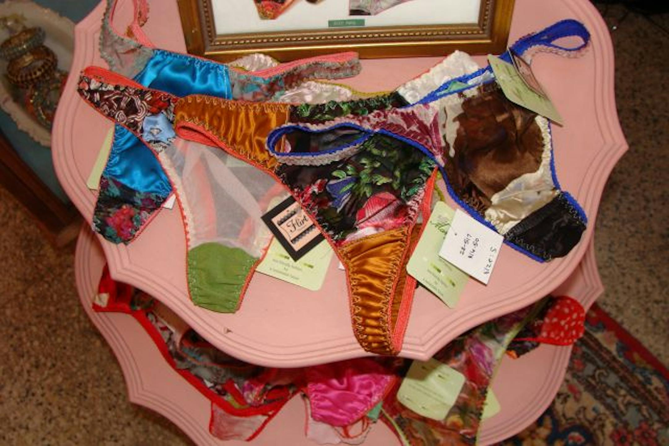 Mary Green thongs made from silk remnants from bolts of fabric, at Flirt boutique.