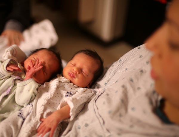 In this file photo, twins are pictured at the Mother Baby Center at Children's Hospital in Minneapolis.