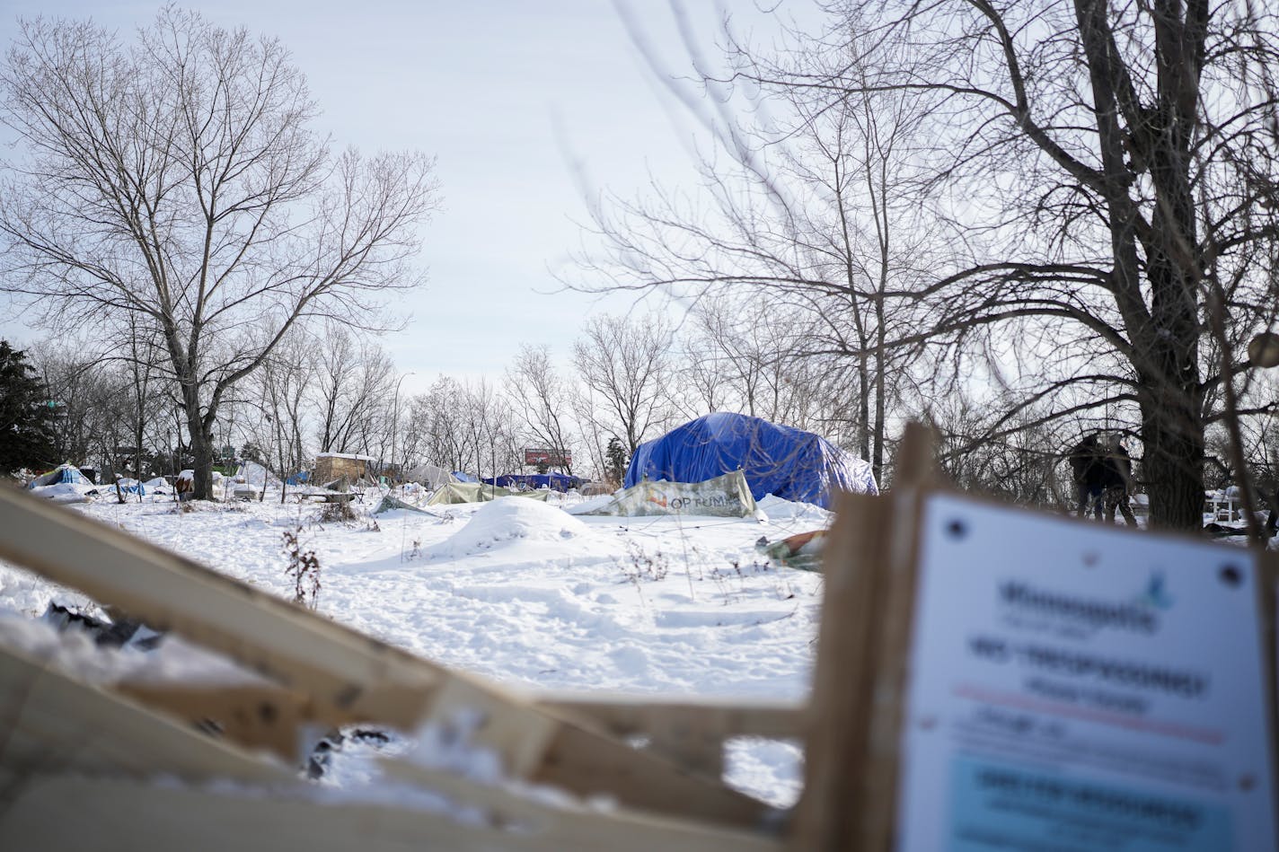 Residents and supporters spoke against the impending municipal clearing of a homeless encampment adjacent to the Quarry shopping center Tuesday, Dec. 27, 2022 in Minneapolis.