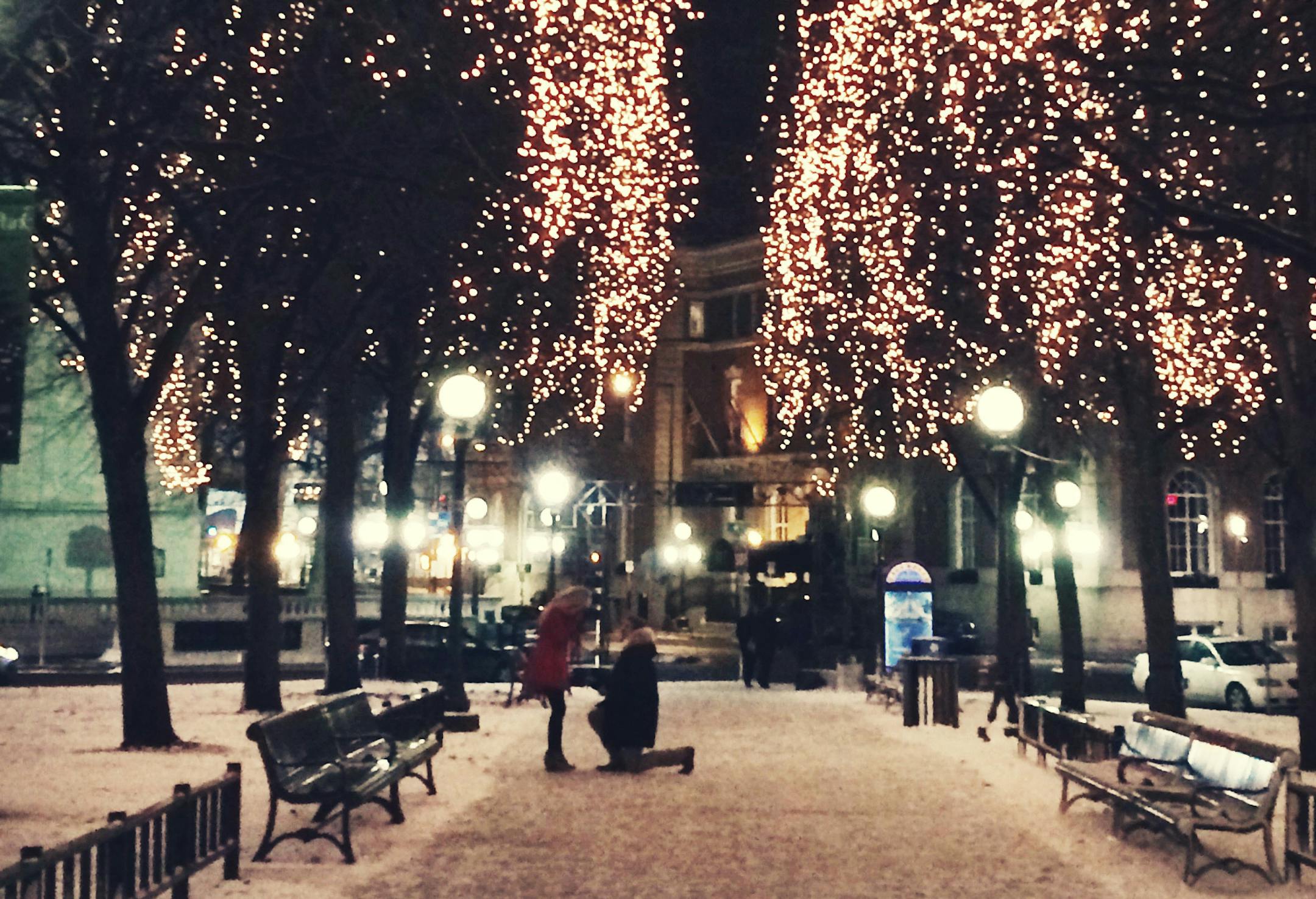 A mystery couple was engaged in Rice Park in St. Paul on Thursday, December 18, 2014 at around 10 p.m., and Joy Son of Minneapolis captured the moment. (Courtesy Joy Son)