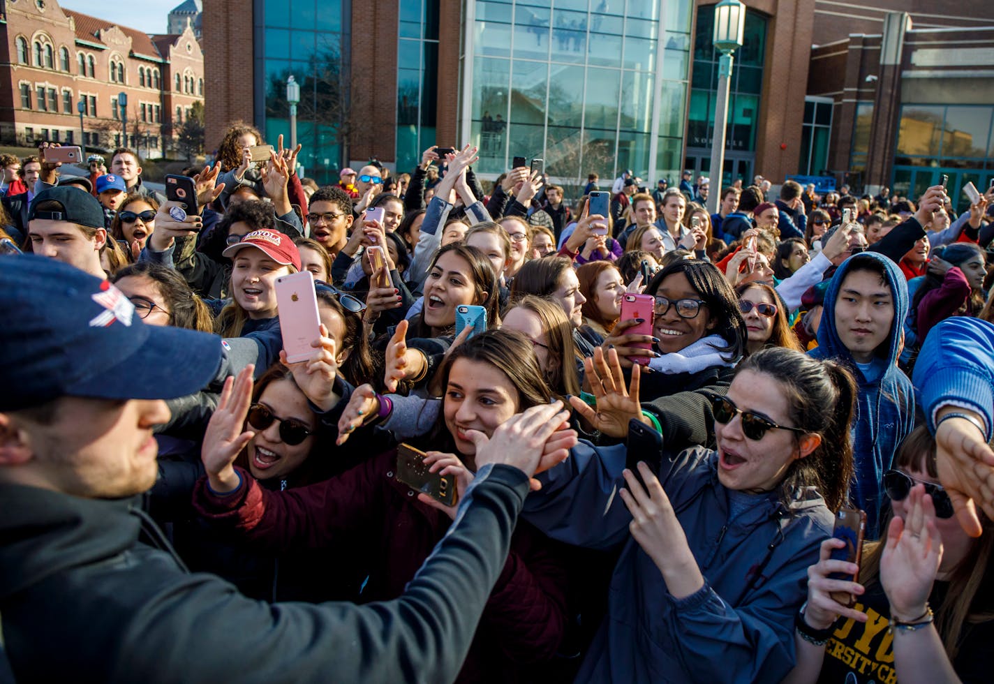 Loyola guard Clayton Custer and teammates greeted fans as they welcomed the Ramblers back to campus on Sunday, after the team advanced to the Sweet 16 of the NCAA tournament in their first appearance since 1985.