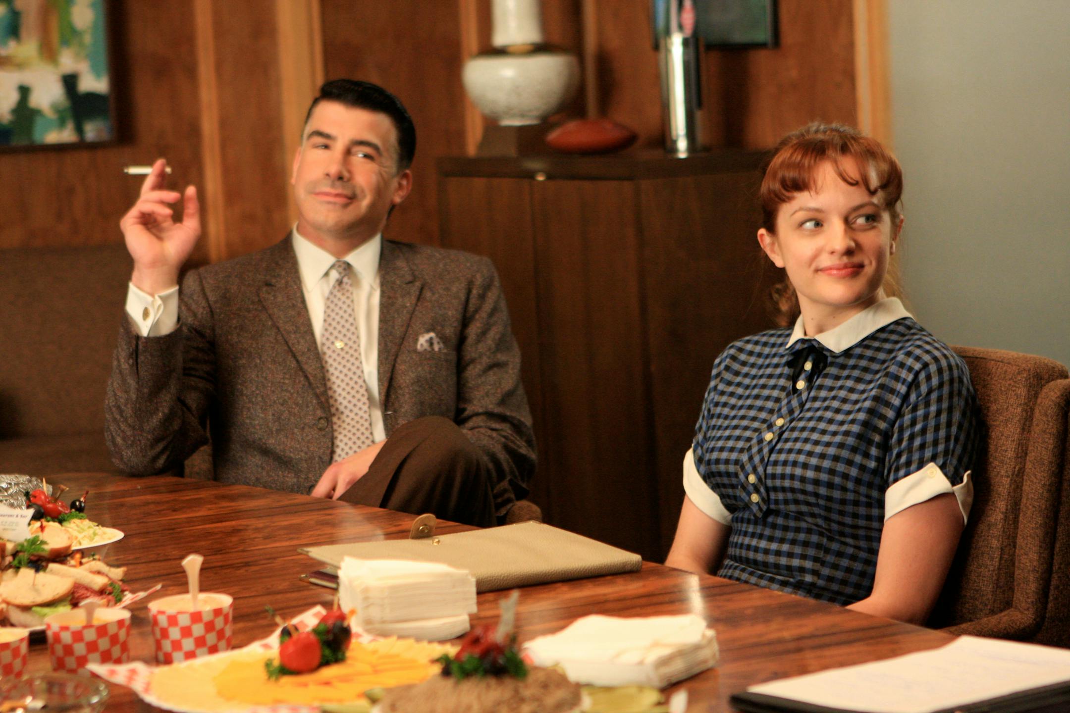Salvatore Romano (Bryan Batt) and Peggy Olson (Elisabeth Moss) at the Sterling Cooper office on "Mad Men."