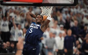 Minnesota Timberwolves guard Anthony Edwards (5) dunks on the Oklahoma City Thunder in the first quarter of Game 3 of the NBA Western Conference final