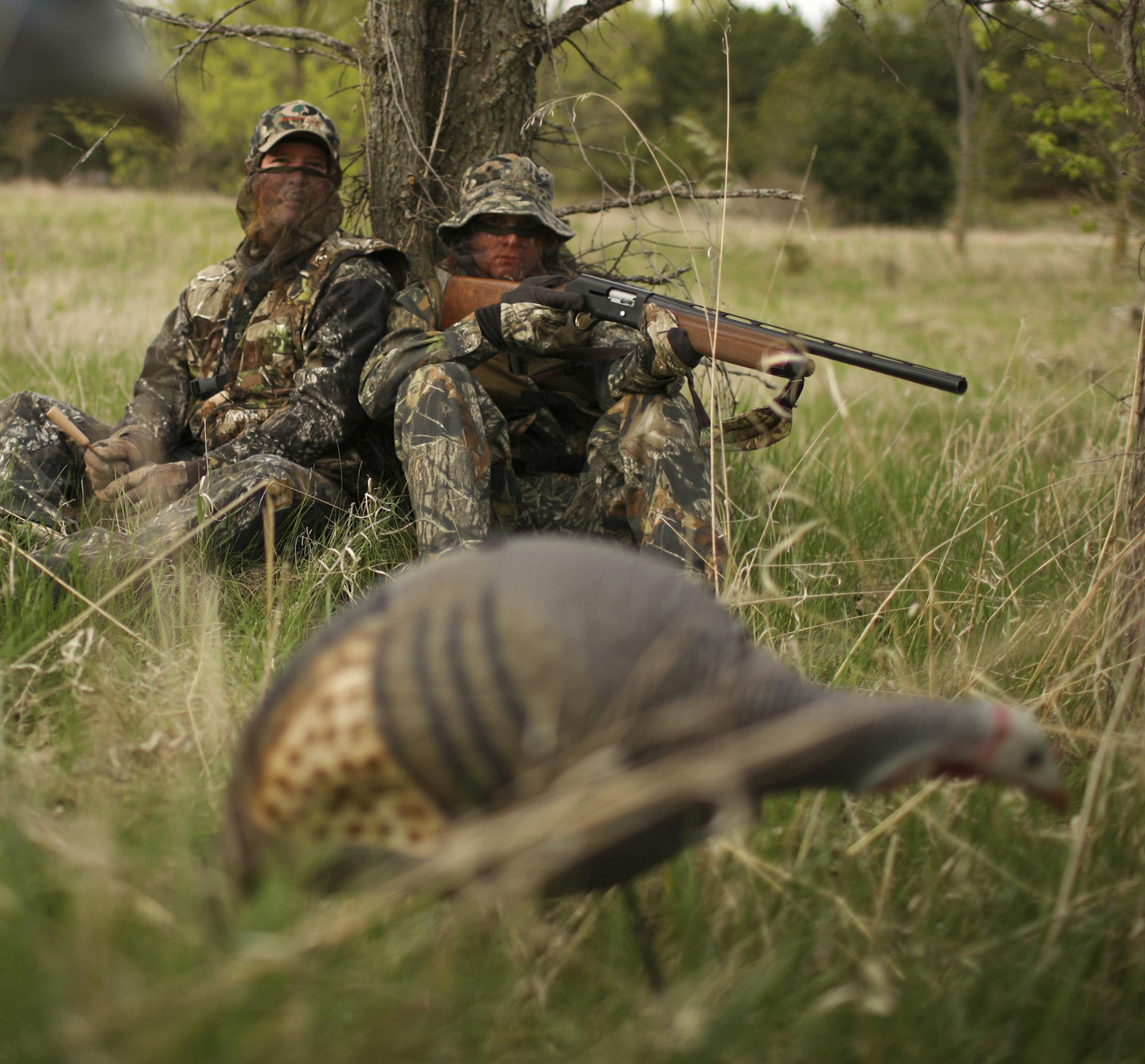 JEFF WHEELER &#x201a;&#xc4;&#xa2; jwheeler@startribune.com HUDSON - 5/11/09 - Andy Sexe has arranged for a wild turkey hunt for his son, Benjamin, 20, who is home between deployments as a U.S. Marine Corps reservist. IN THIS PHOTO: ] Andy, left, and Benjamin Sexe, in their gobbler garb near their home outside Hudson, WI Monday evening. ORG XMIT: MIN2013040508411118