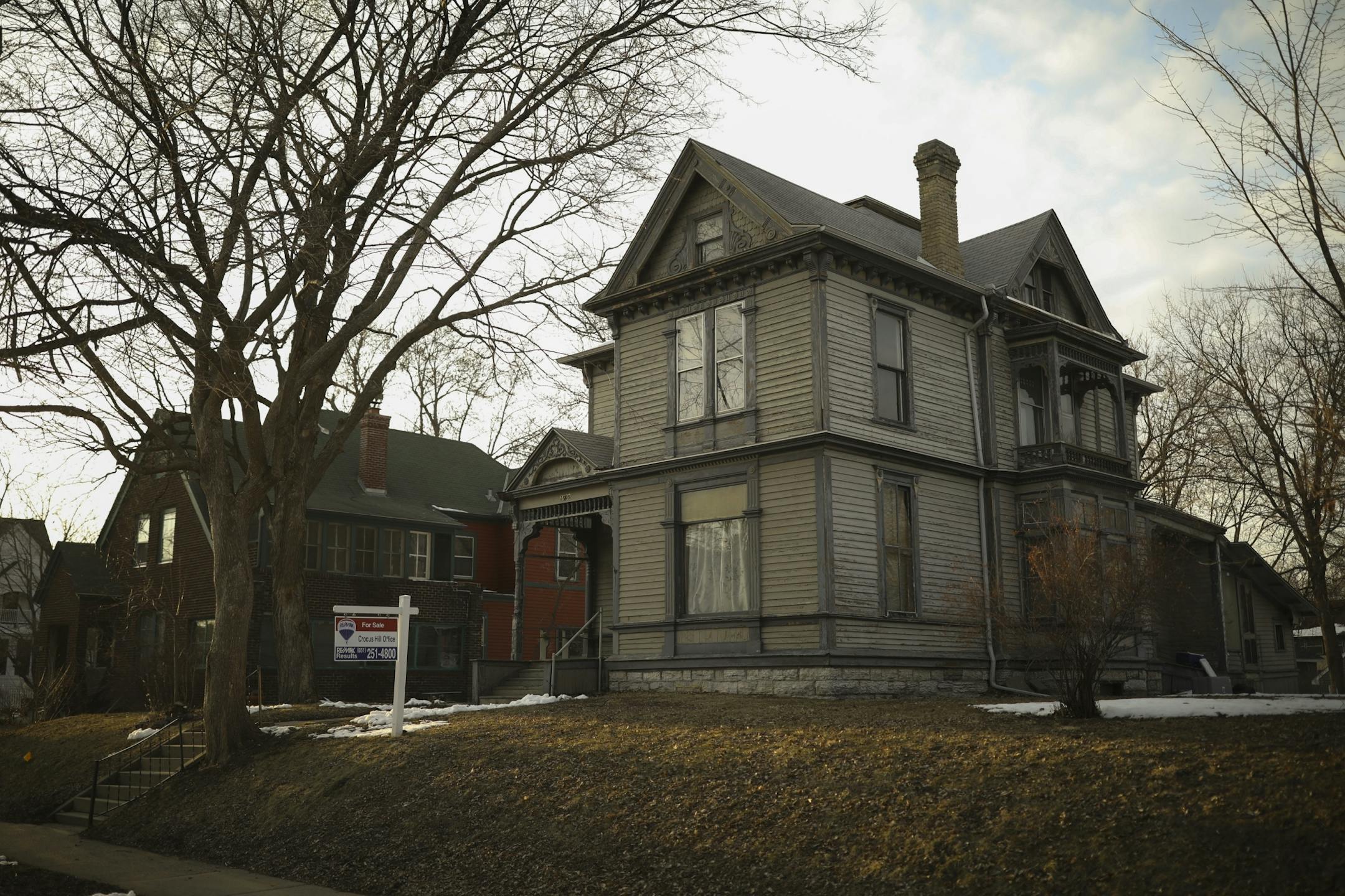 The house at 1905 Iglehart Ave., right, where Michael Tierney and his eight siblings grew up. At left is 1911 Iglehart Ave., which his family also owns and hopes to sell.