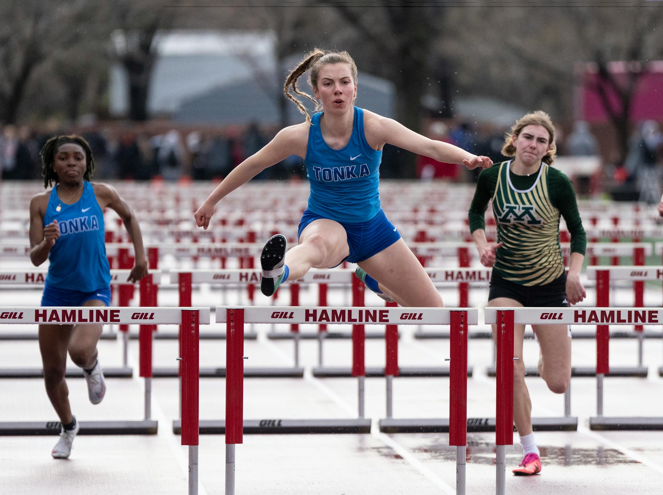 Minnetonka's Claire Kohler leads the girls 100 meter hurdles race to win with a time of 14.45 during the Hamline Elite Meet at Hamline University.