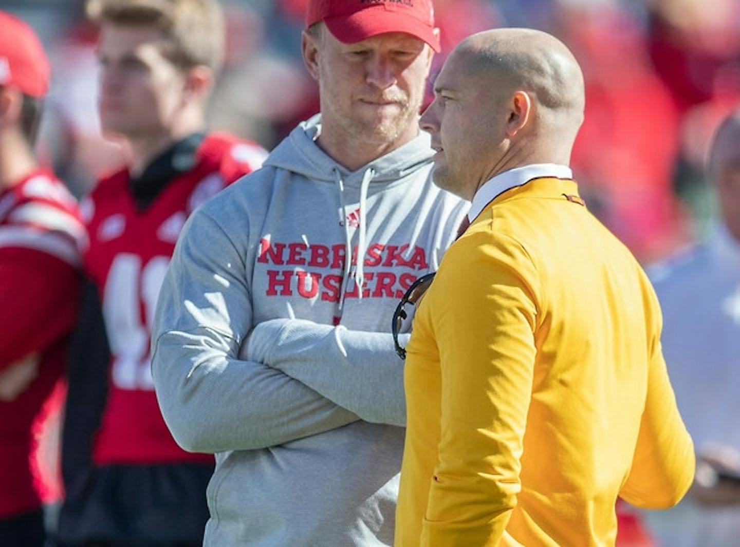 Nebraska coach Scott Frost and Gophers coach P.J. Fleck talked before a game between their teams in 2018. Frost is a strong advocate for playing: "We want to play no matter who it is or where it is, so we'll see how those chips fall." Fleck didn't comment Monday.