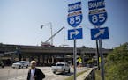 Construction crews work on a repaired section of an overpass that collapsed on Interstate 85 in Atlanta, Wednesday, May 10, 2017. Atlanta drivers can 