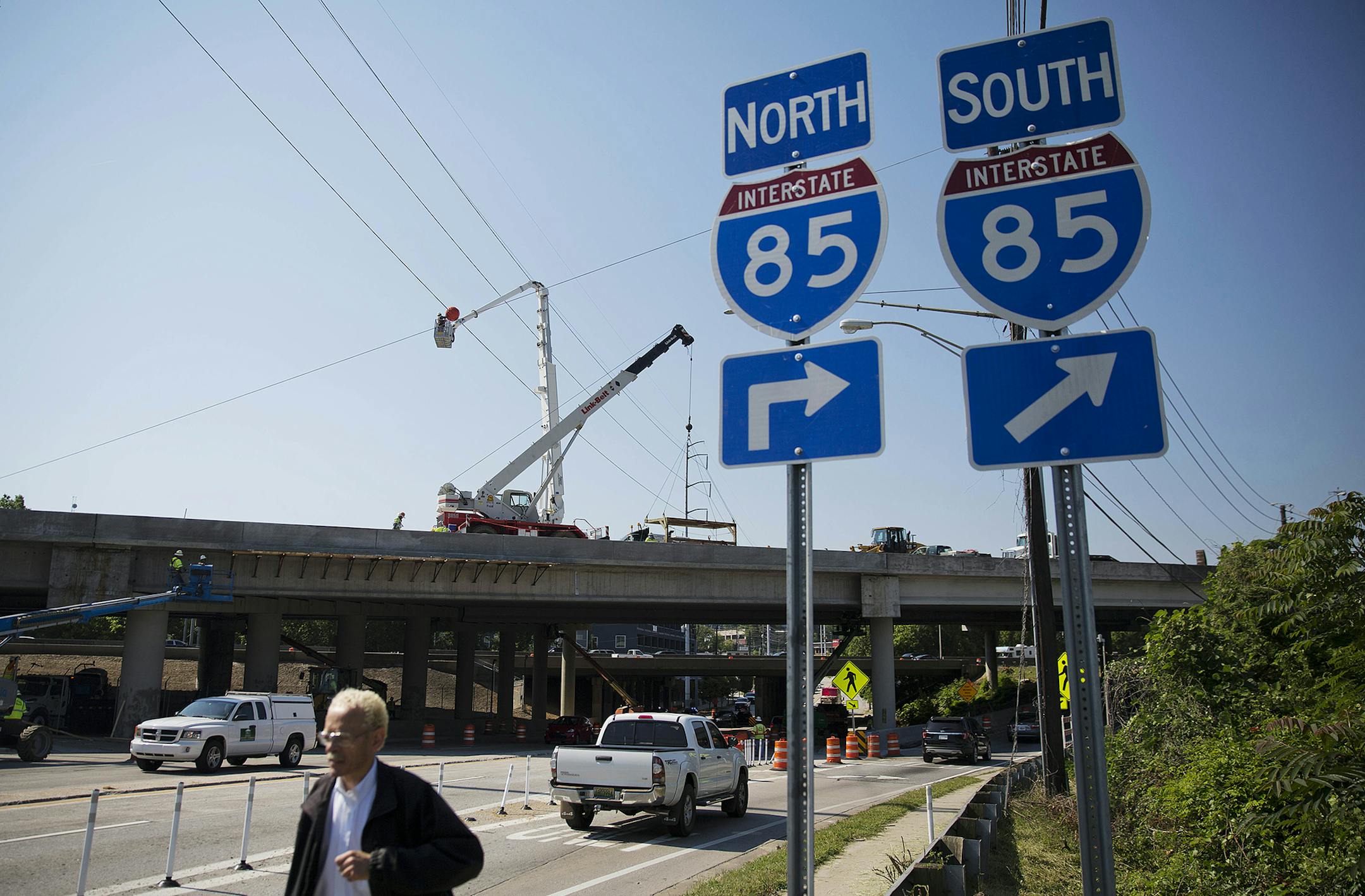 Construction crews work on a repaired section of an overpass that collapsed on Interstate 85 in Atlanta, Wednesday, May 10, 2017. Atlanta drivers can resume using the heavily used interstate by Monday morning's rush hour, Georgia's governor and state transportation officials announced Wednesday, about six weeks since a bridge on the roadway collapsed due to a large fire. (AP Photo/David Goldman) ORG XMIT: MIN2017052412570741