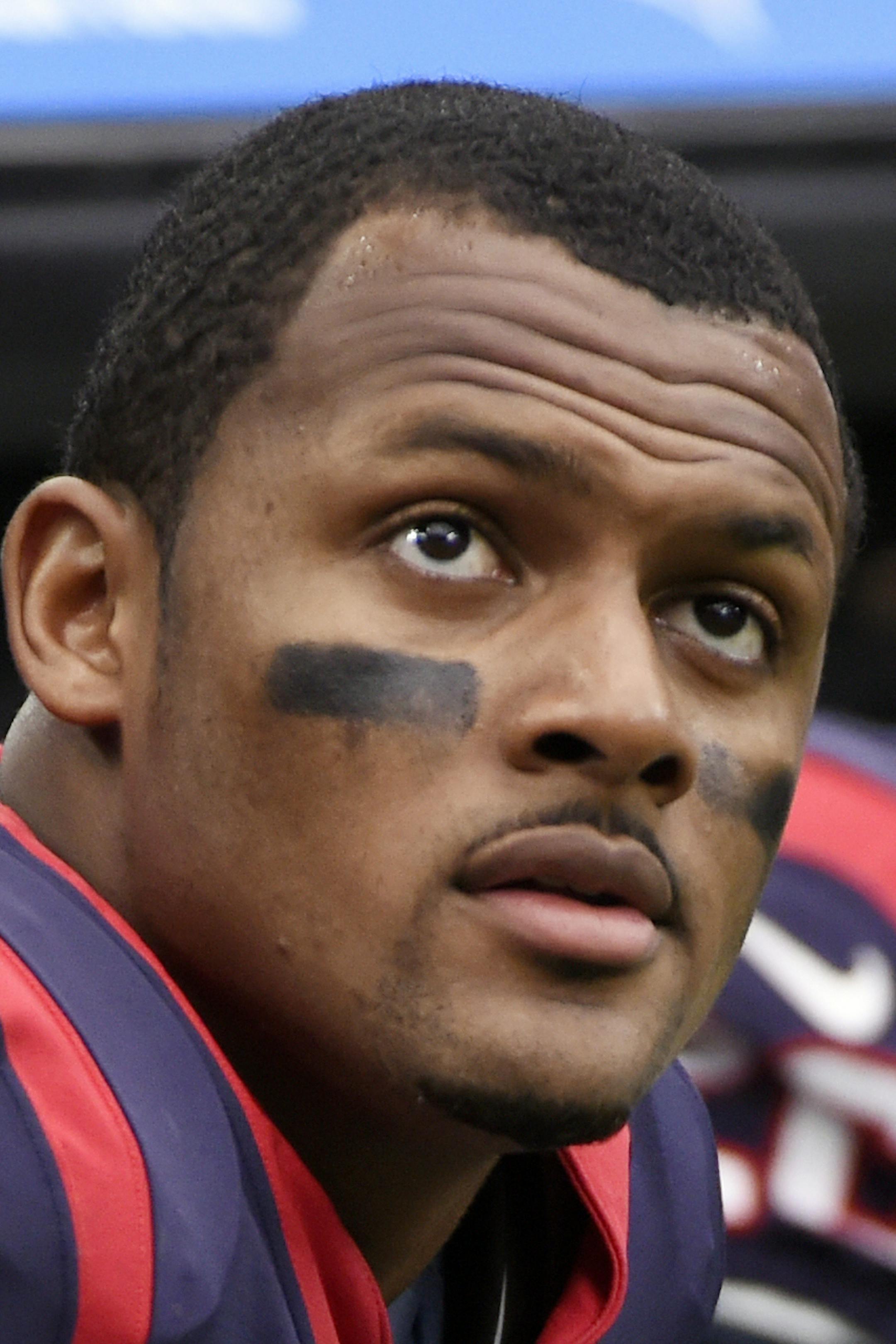 FILE - In this Sunday, Oct. 15, 2017, file photo, Houston Texans quarterback Deshaun Watson (4) sits on the sideline during an NFL football game against the Cleveland Browns in Houston. Two people familiar with the situation tell The Associated Press that Watson sustained a season-ending knee injury in practice on Thursday, Nov. 2, 2017. The rookie suffered a torn anterior cruciate ligament in one of his knees and will go on the injured reserve. The people spoke on the condition of anonymity bec