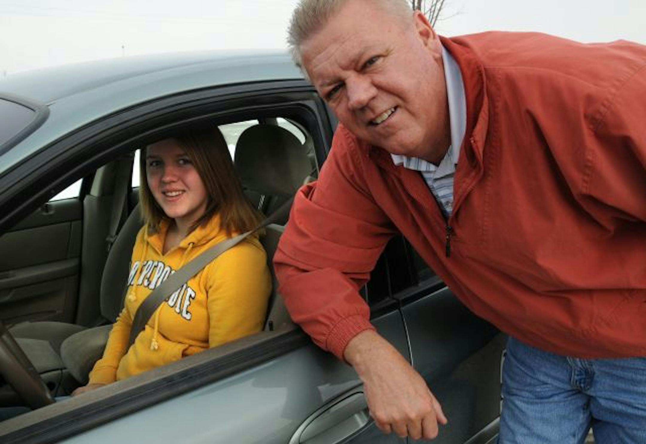 Mike Pehl, driving instructor, with 15-year-old Annette Olson.