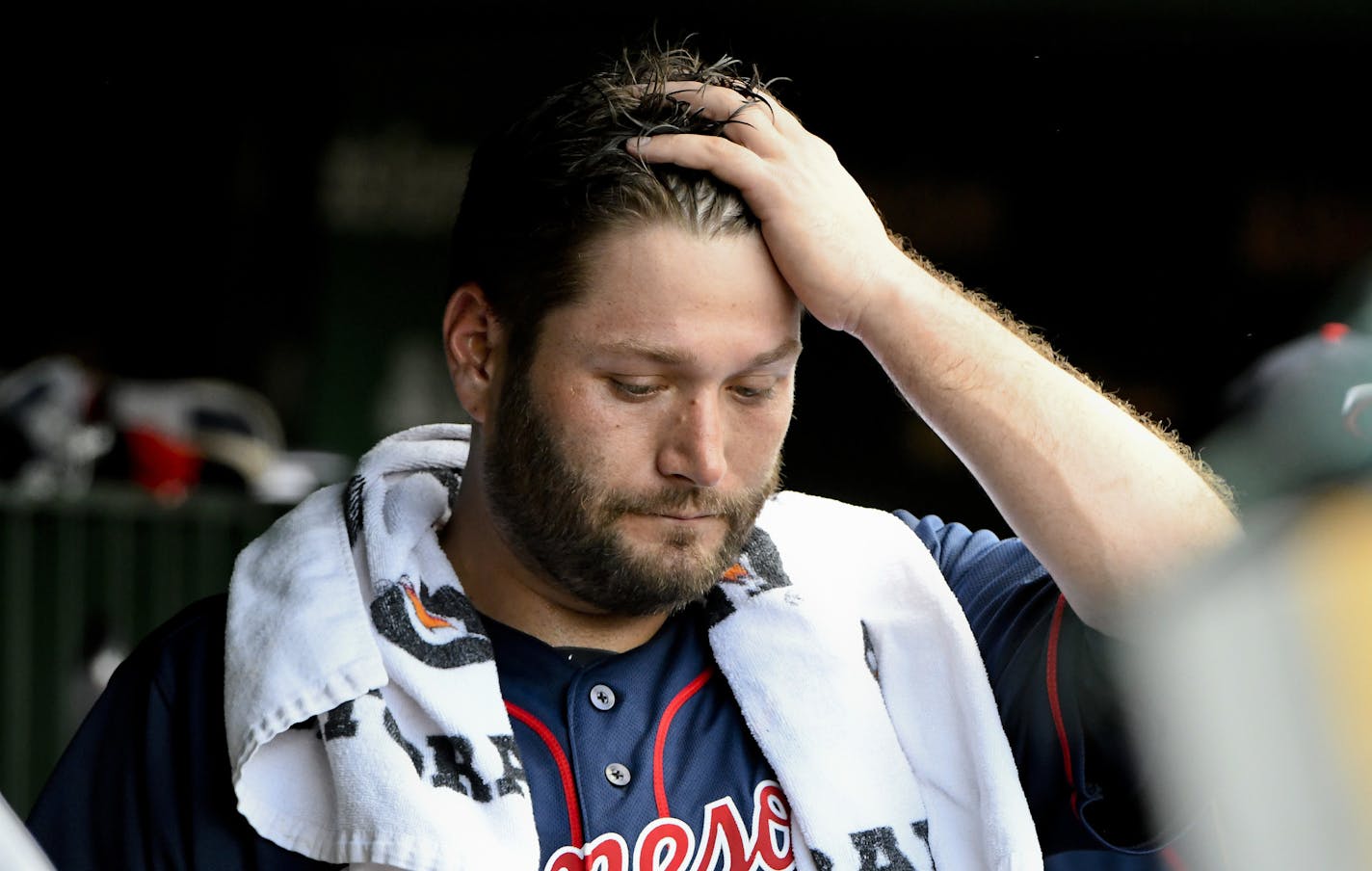 Minnesota Twins starting pitcher Lance Lynn (31) stands in the dugout after being relieved during the second inning of an baseball game against the Chicago Cubs on Sunday, July 1, 2018, in Chicago. (AP Photo/Matt Marton)