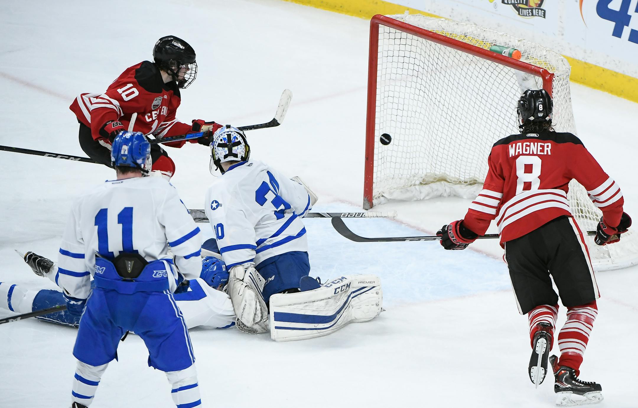 Centennial forward Jack Menne (10) scored the game-tying goal on St. Thomas Academy goaltender Atticus Kelly (30) in the third period. ] AARON LAVINSKY &#xef; aaron.lavinsky@startribune.com Centennial played St. Thomas Academy in the Class 2A boys&#xed; hockey quarterfinals on Thursday, March 8, 2018 at the Xcel Energy Center in St. Paul, Minn.