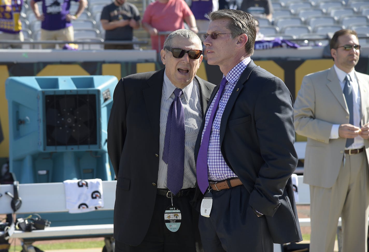 Minnesota Vikings owner Leonard Wilf, left, and general manager Rick Spielman chat on the sideline before an NFL football game against the Jacksonville Jaguars in Jacksonville, Fla., Sunday, Dec. 11, 2016. (AP Photo/Phelan M. Ebenhack) ORG XMIT: MIN2017012114565144