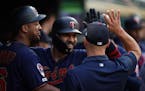 Minnesota Twins third baseman Marwin Gonzalez (9) celebrated with his teammates in the dugout after hitting a two-run home run in the fifth inning.