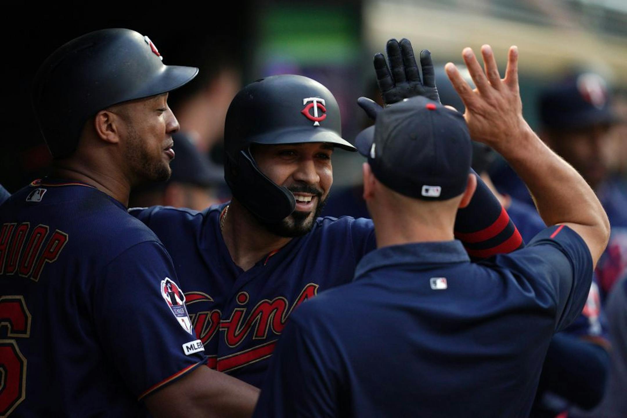 Minnesota Twins third baseman Marwin Gonzalez (9) celebrated with his teammates in the dugout after hitting a two-run home run in the fifth inning.