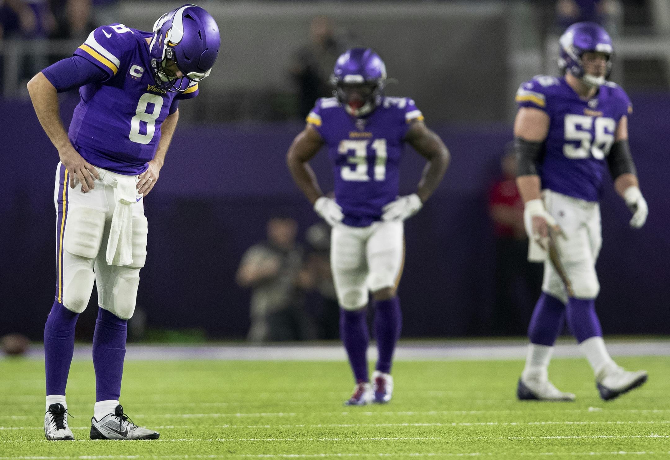 Minnesota Vikings quarterback Kirk Cousins (8) reacted after watching a replay of a holding penalty that negated a long touchdown pass to Bisi Johnson in the fourth quarter.