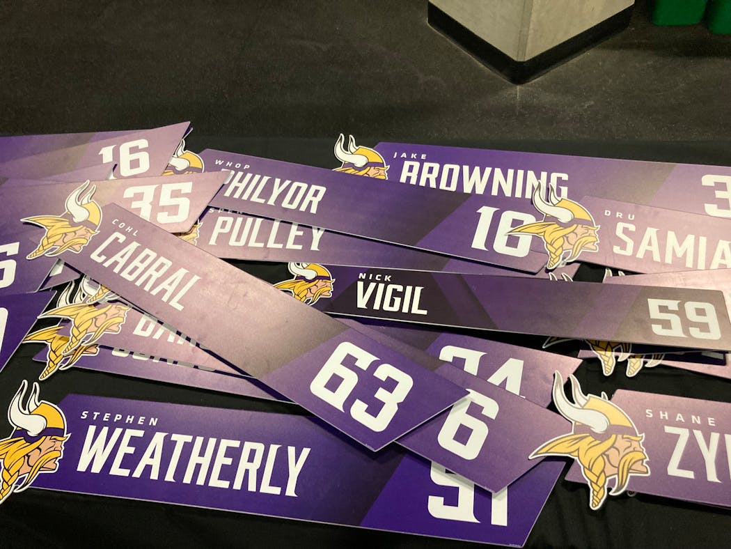 Leftover locker room nameplates on sale at the Vikings Draft Party.