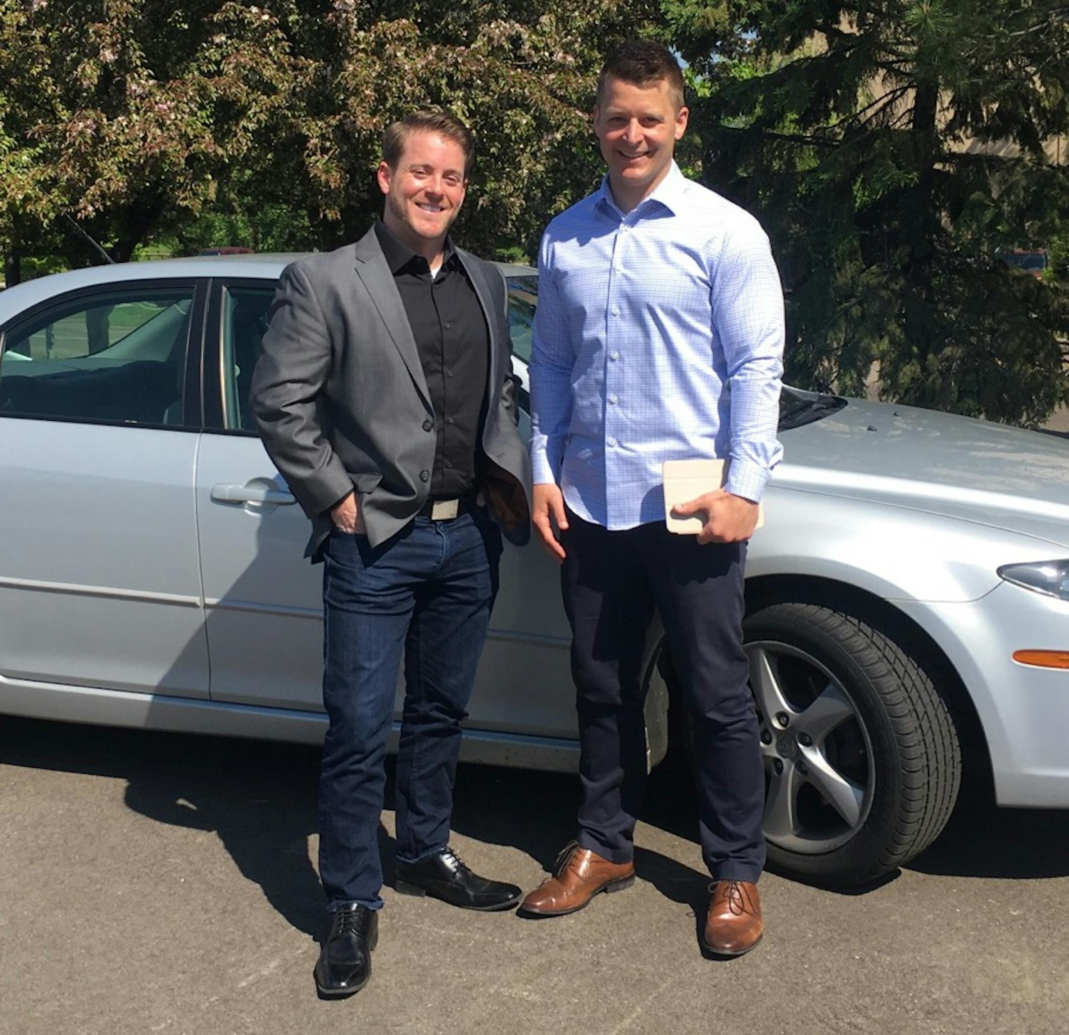 Koelln, right, and CheckNGN President Tony Manelli are starting their business targeting 16,000 drivers in the Twin Cities.