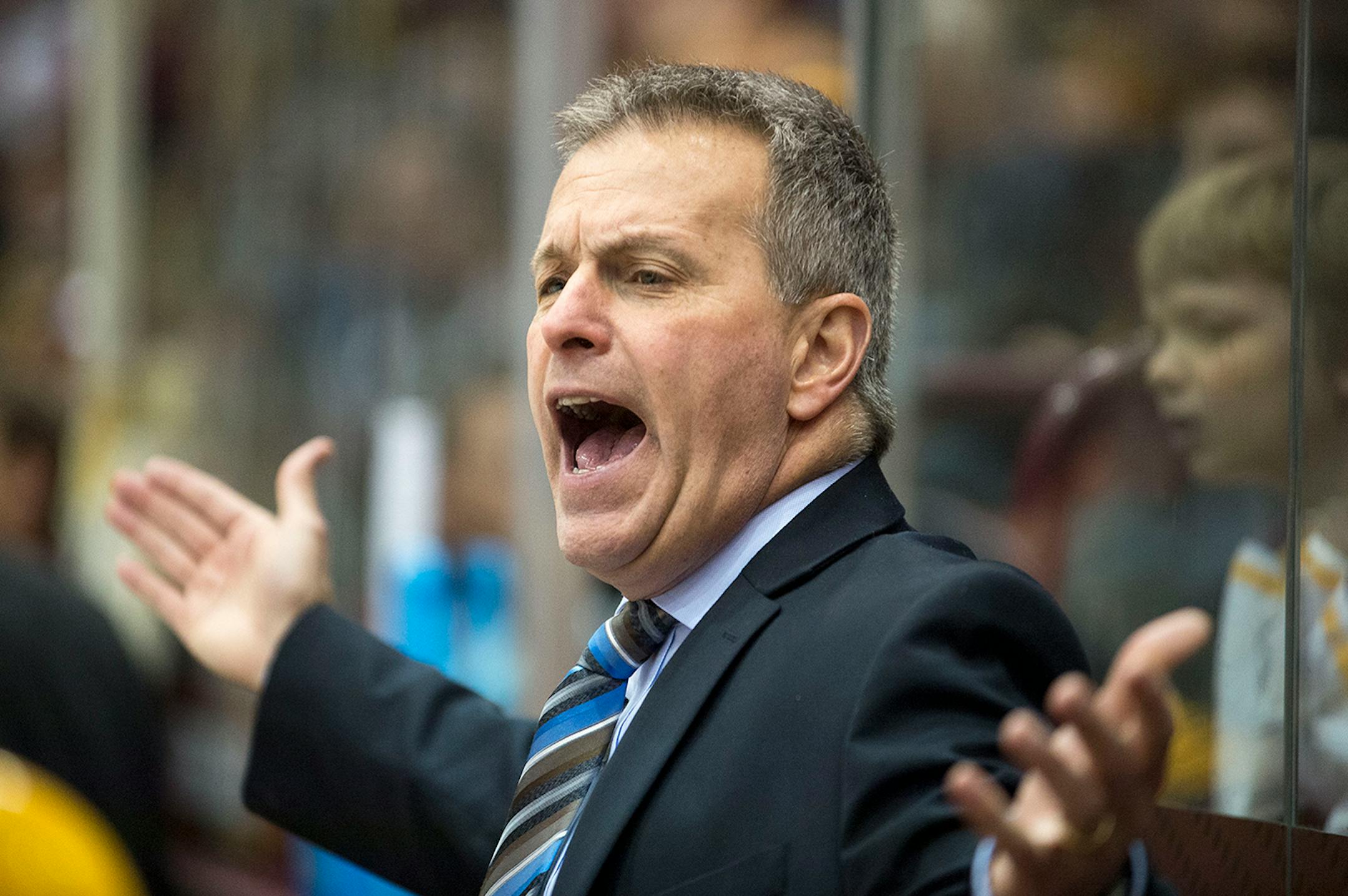 University of Minnesota Head Coach Don Lucia argues an icing call with officials during the third period against Ohio State on Saturday night. ] (Aaron Lavinsky | StarTribune) University of Minnesota men's hockey takes on Ohio State on Saturday, Feb. 7, 2015 at Mariucci Arena.