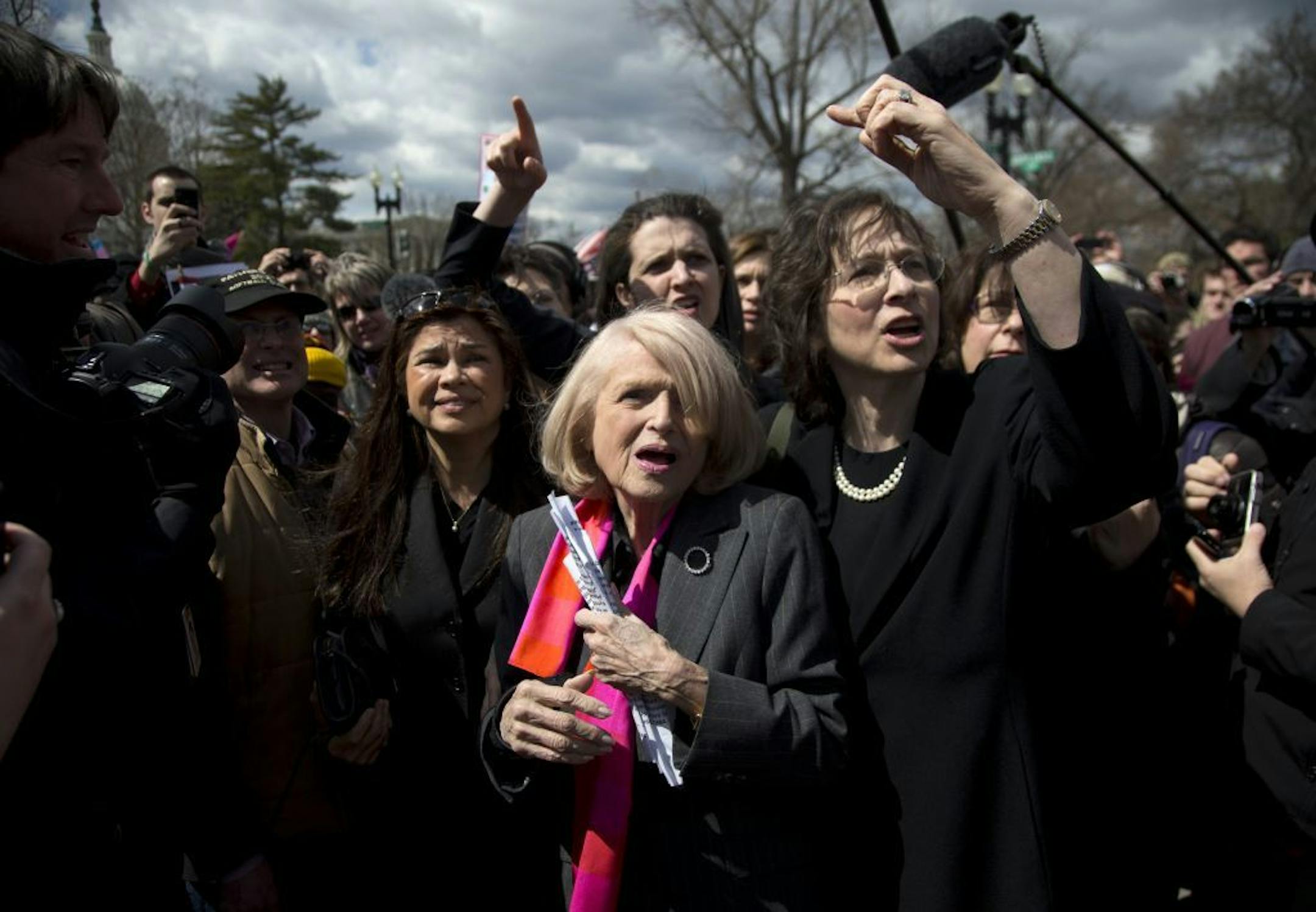 Plaintiff Edith Windsor of New York, center, tries to move through the crowd in front of the Supreme Court in Washington, Wednesday.
