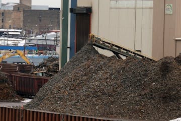 The Northern Metals Recycling facility, located on the Mississippi River just south of the Lowry Avenue Bridge in Minneapolis. Families in north Minne