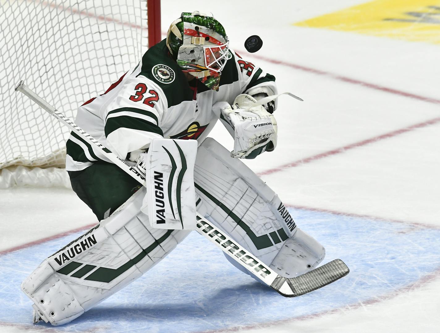 Minnesota Wild goaltender Alex Stalock (32) makes a save during the third period against the Colorado Avalanche in an NHL preseason hockey game, Sunday, Sept. 22, 2019, in Denver. (AP Photo/John Leyba)