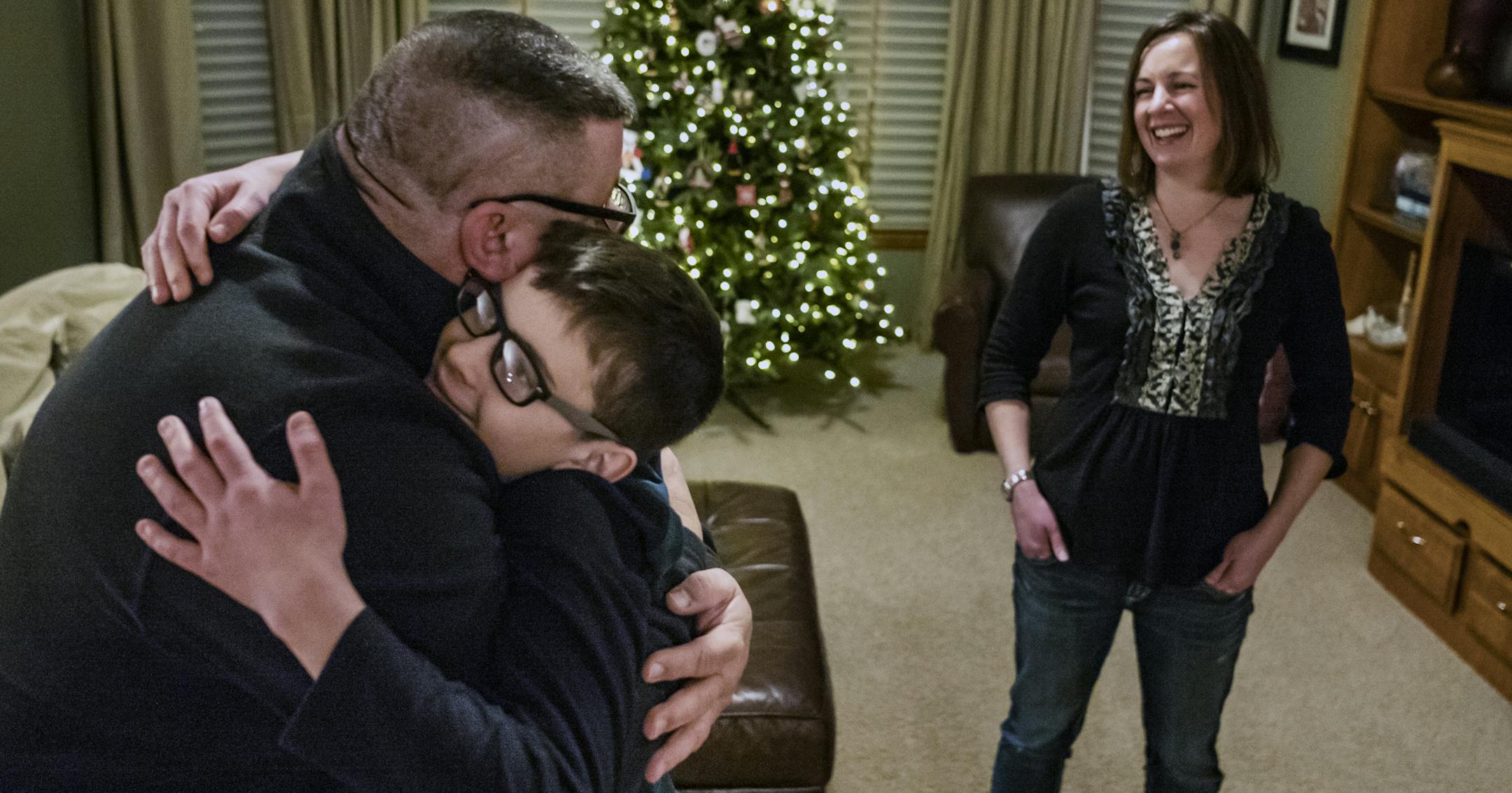 Buzz Taggart gives her son, Jack,14, a hug before he heads out to tape the basketball game for the video club. Mom Sherri is in the background . ] Jack Taggart and his family have received help from Pinky Swear. We photograph the family before dinner. Jack,a middle schooler, is recovering from lukemia. He has two brothers. RICHARD TSONG-TAATARII &#x2022; richard.tsong-taatarii@startribune.com