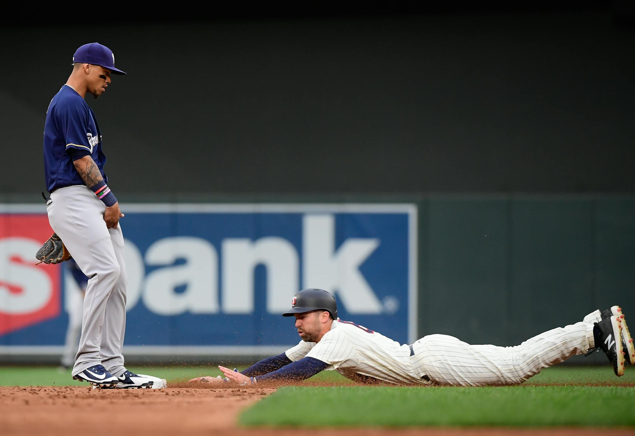 Minnesota Twins center fielder Jake Cave (60) slid safely into second on a steal without a challenge by Milwaukee Brewers second baseman Jonathan Villar (5) in the bottom of the second. ] AARON LAVINSKY � aaron.lavinsky@startribune.com The Minnesota Twins played the Milwaukee Brewers on Saturday, May 19, 2018 at Target Field in Minneapolis, Minn.