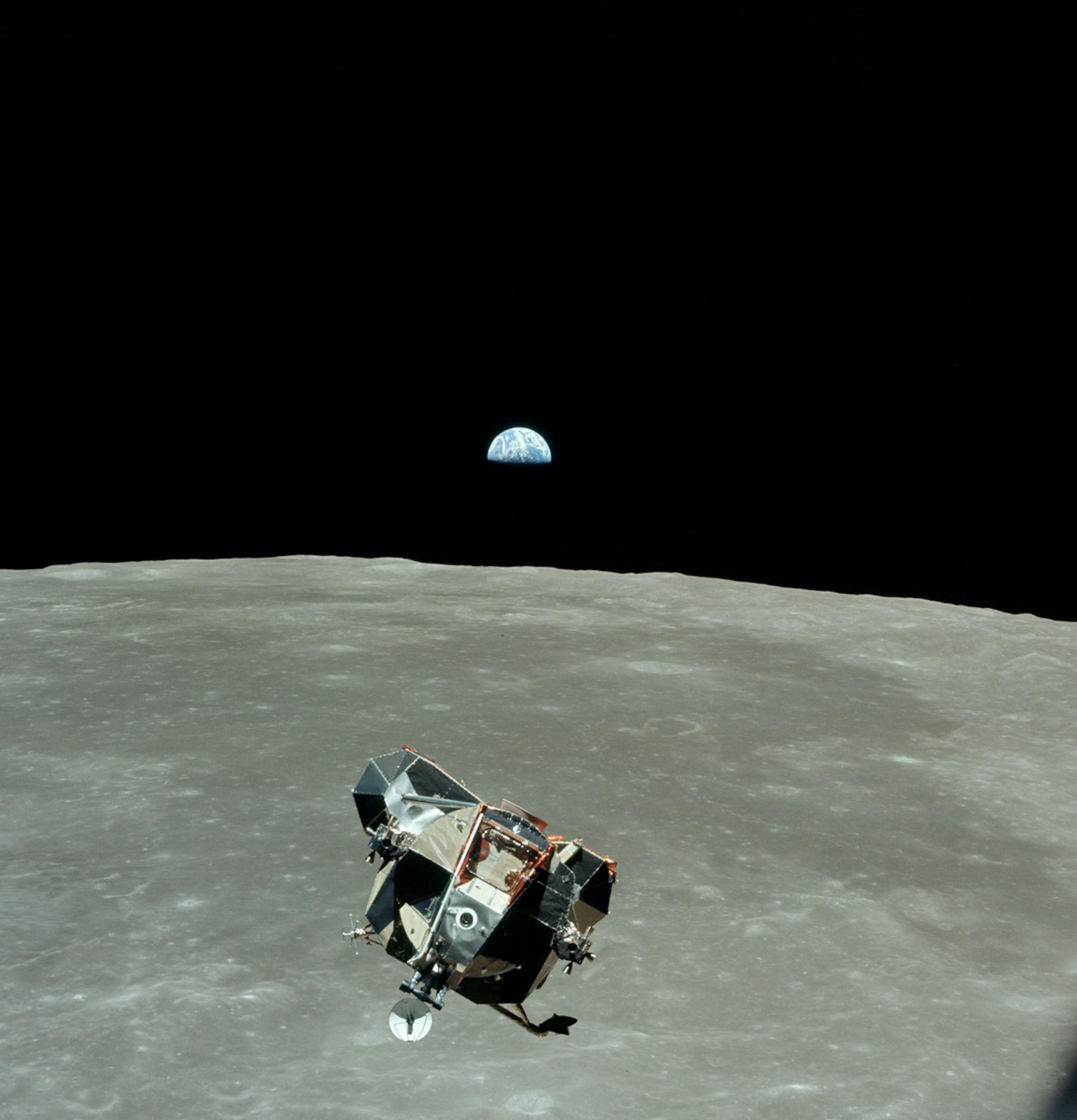 Earth and the front of the LM whilst adjusting its roll. Mare Smythii is beyond the LM - Moon Landing Live_ Season 1, Episode 2 - Photo Credit: BBC America/72 Films/NASA 1969
